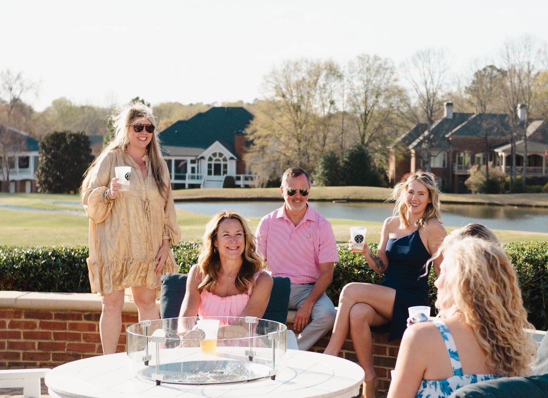 Our mobile bar setup at a beautiful wedding in Athens, GA featuring guests sipping on craft cocktails provided by Athens On Tap at the golf course at The Georgia Club.