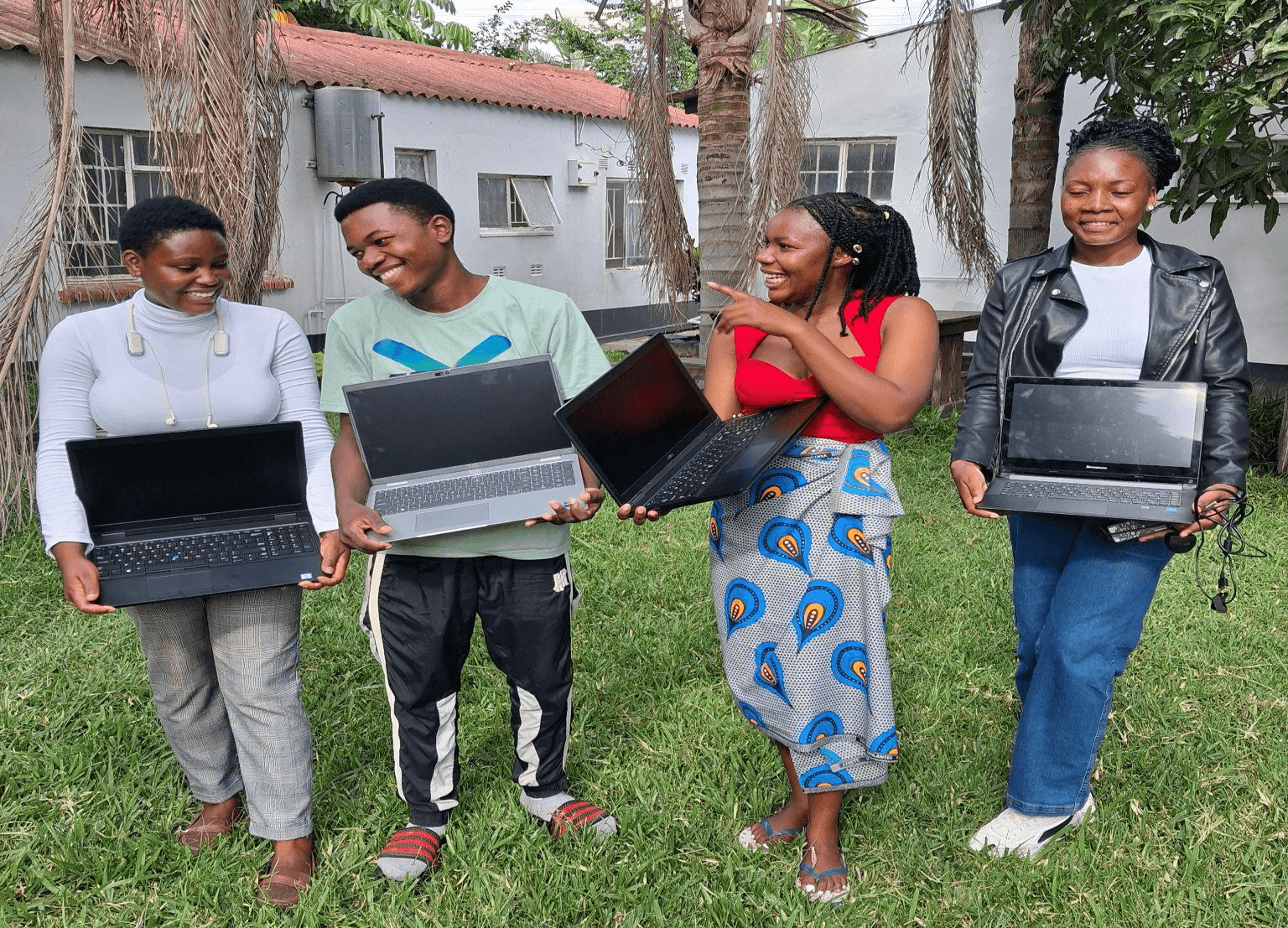 Students receive laptops from Grassroots heroes