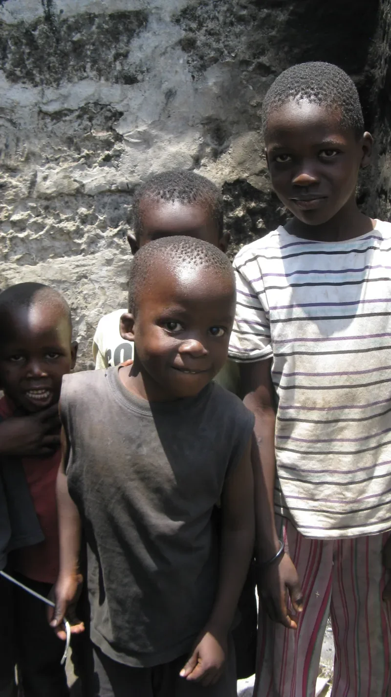 Life For Children Ministry volunteers serving street kids with food and the Gospel in Kisumu
