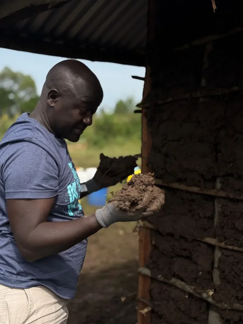 Michael assisting in Life For Children Ministry's widow home construction program in Kenya