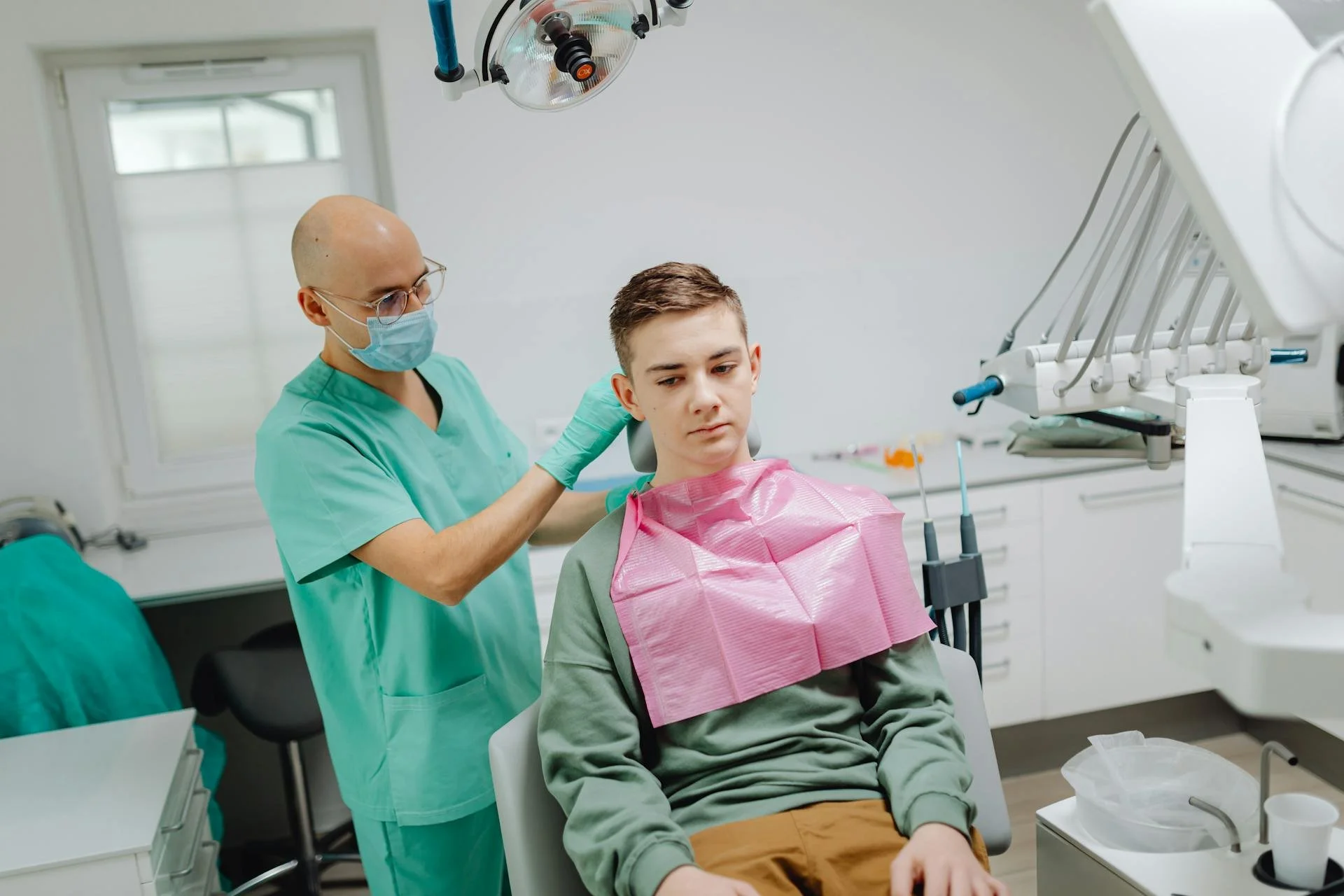 a dentist prepares their patient for a dental exam, their patient is covered by a cheap health and dental plan in ontario
