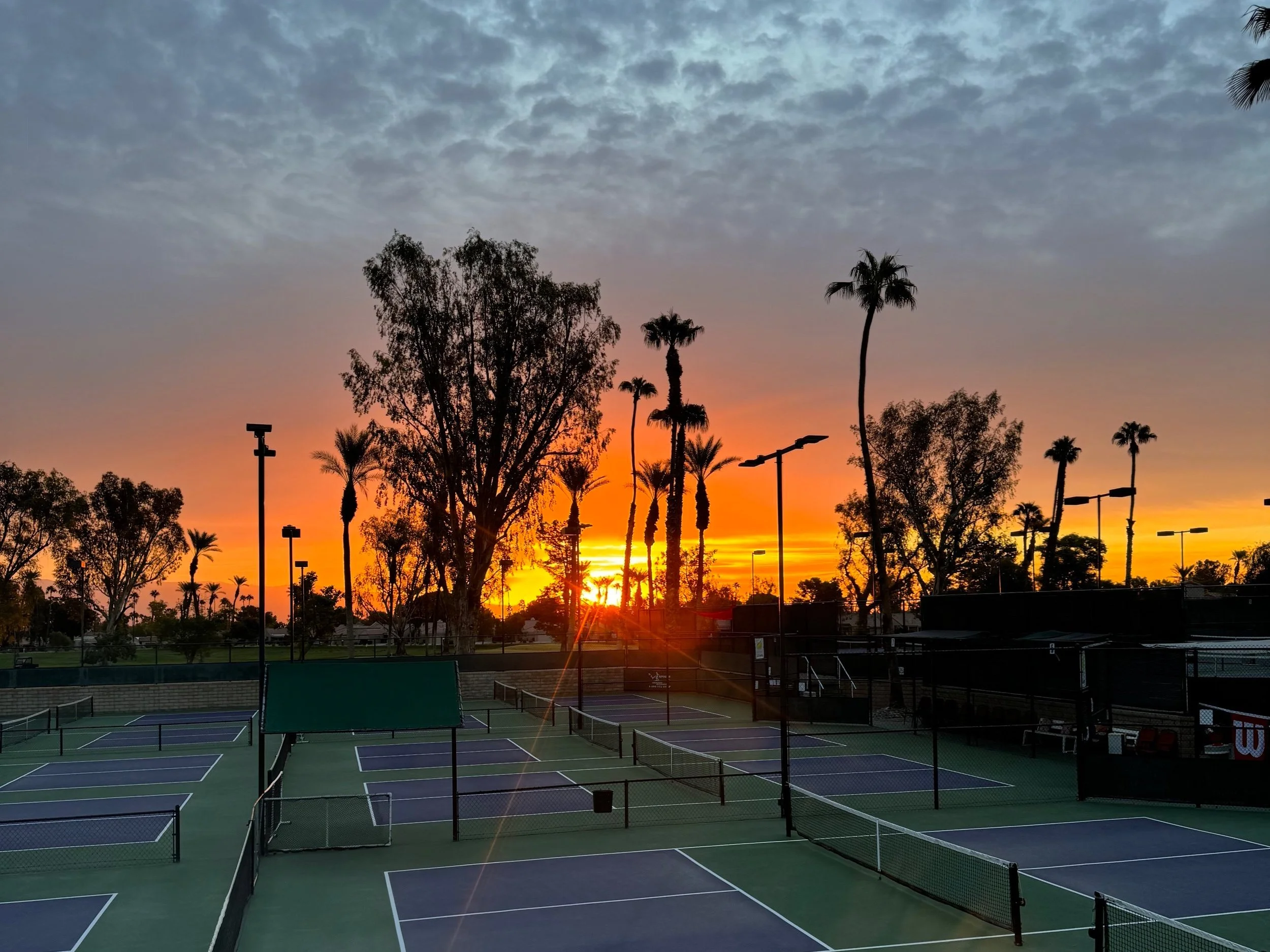 Sunrise over pickleball courts.