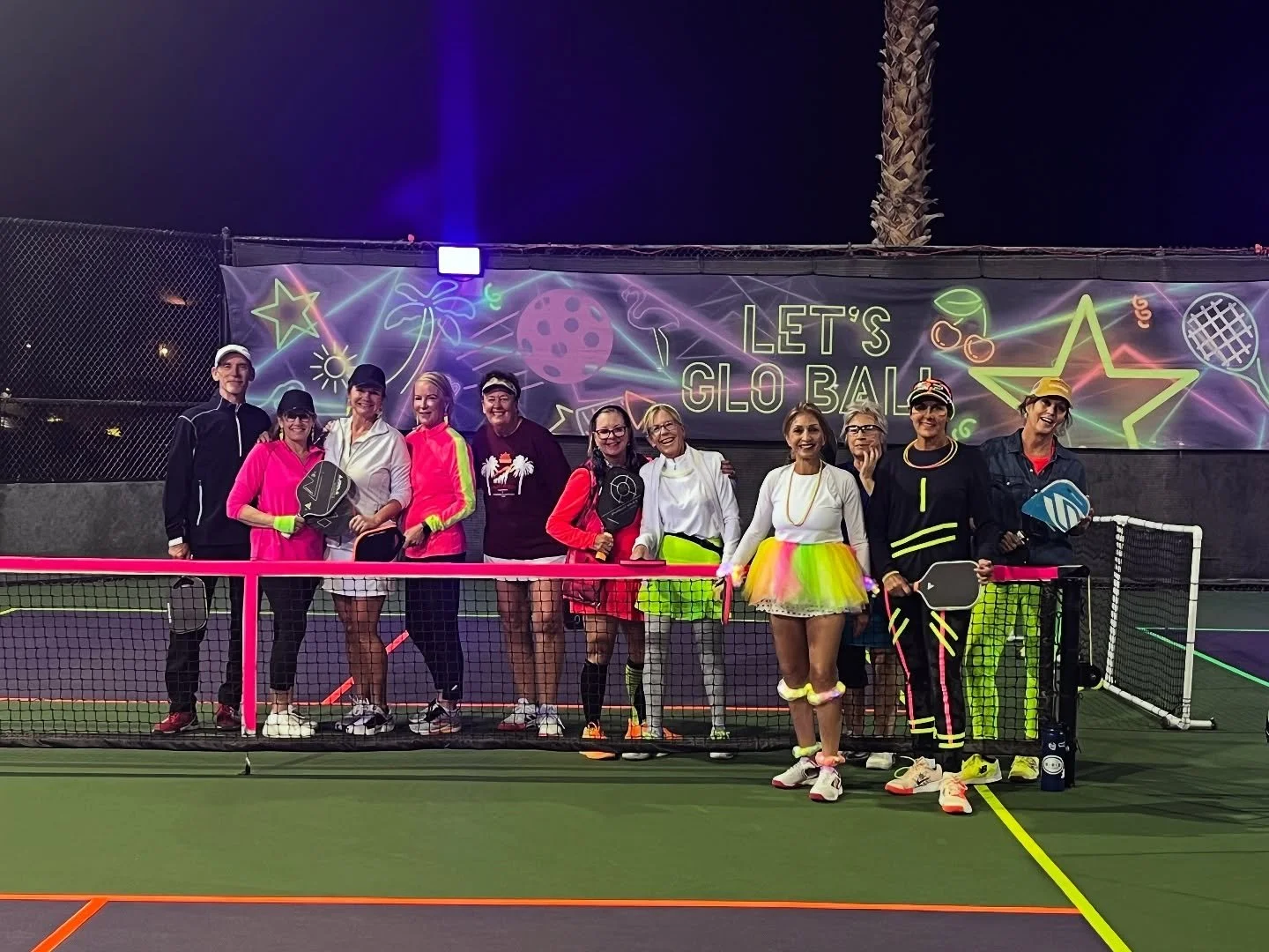 Group photo in neon attire.