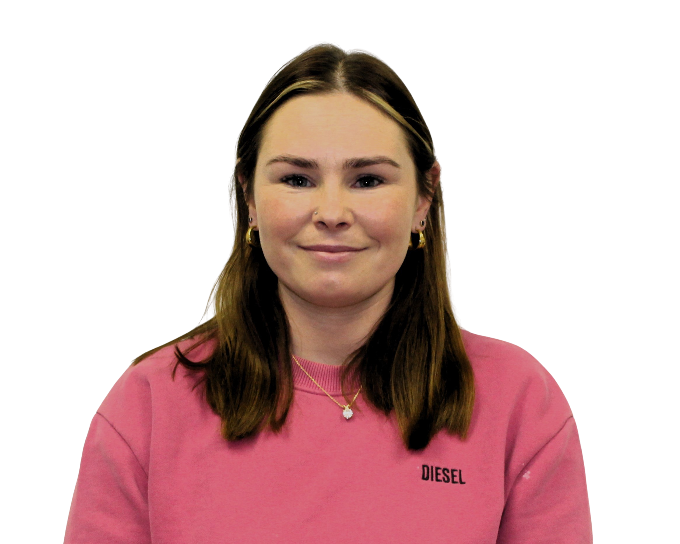 A person smiling with short brown hair, wearing a black shirt, against a plain background.