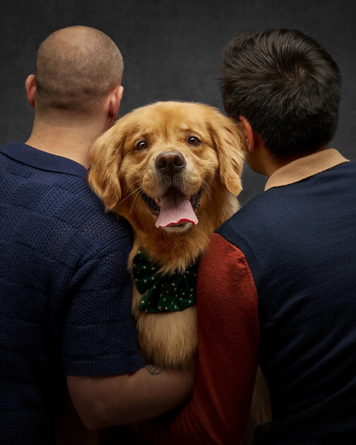 One of my favorite moments to capture is the face of a dog sitting between his humans. The eye glimmer, the at ease smile, the understanding that they are loved. 

By Tobin&rsquo;s smile, it is easy to see he knows just how loved he is by his humans 