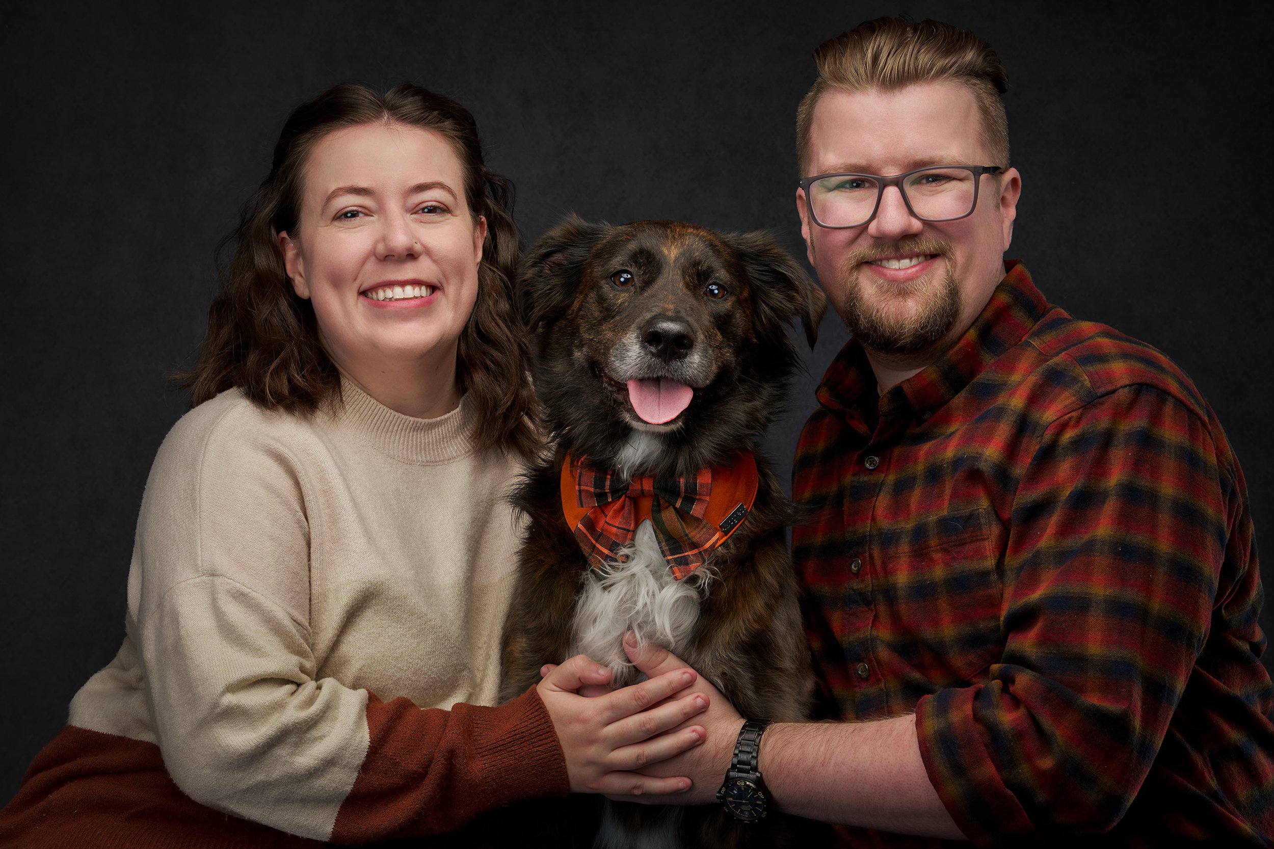 dog parents photographed with their australian shepherd in eastside downtown kirkland photo studio