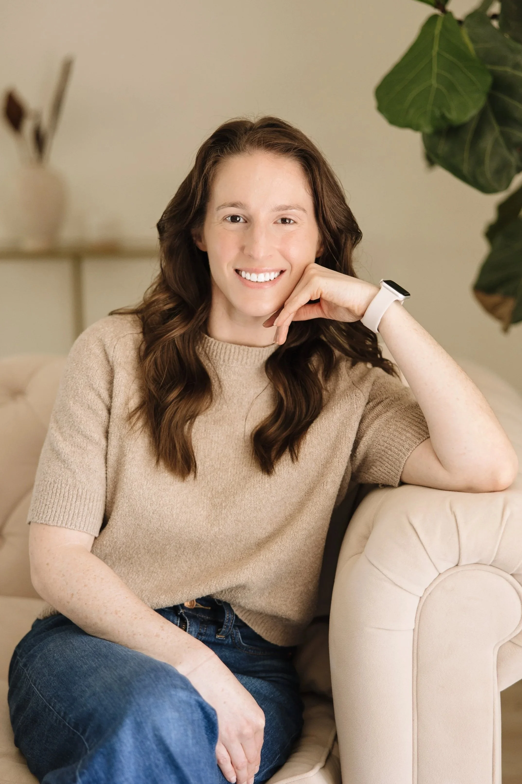 Brunette Therapist on cream couch