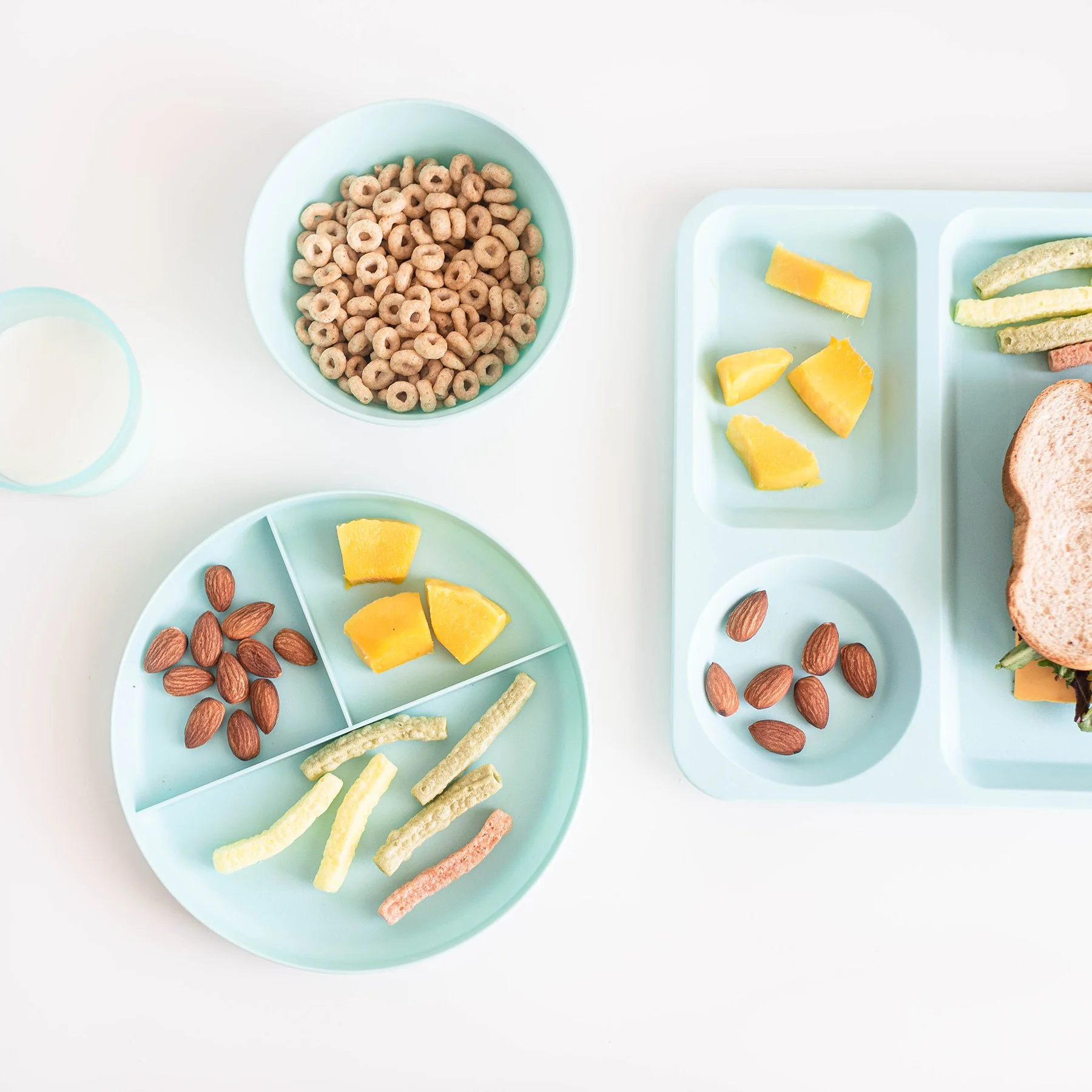 Children’s snack plates with finger foods used for messy food play during summer OT activities.