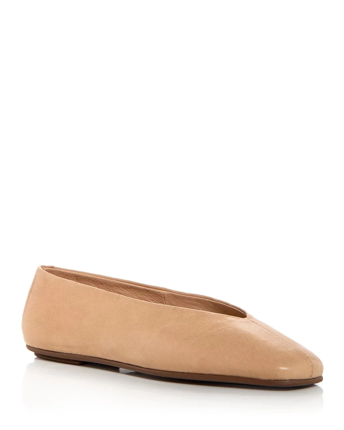 Beige leather ballet flat shoe with closed toe and low heel on a white background.