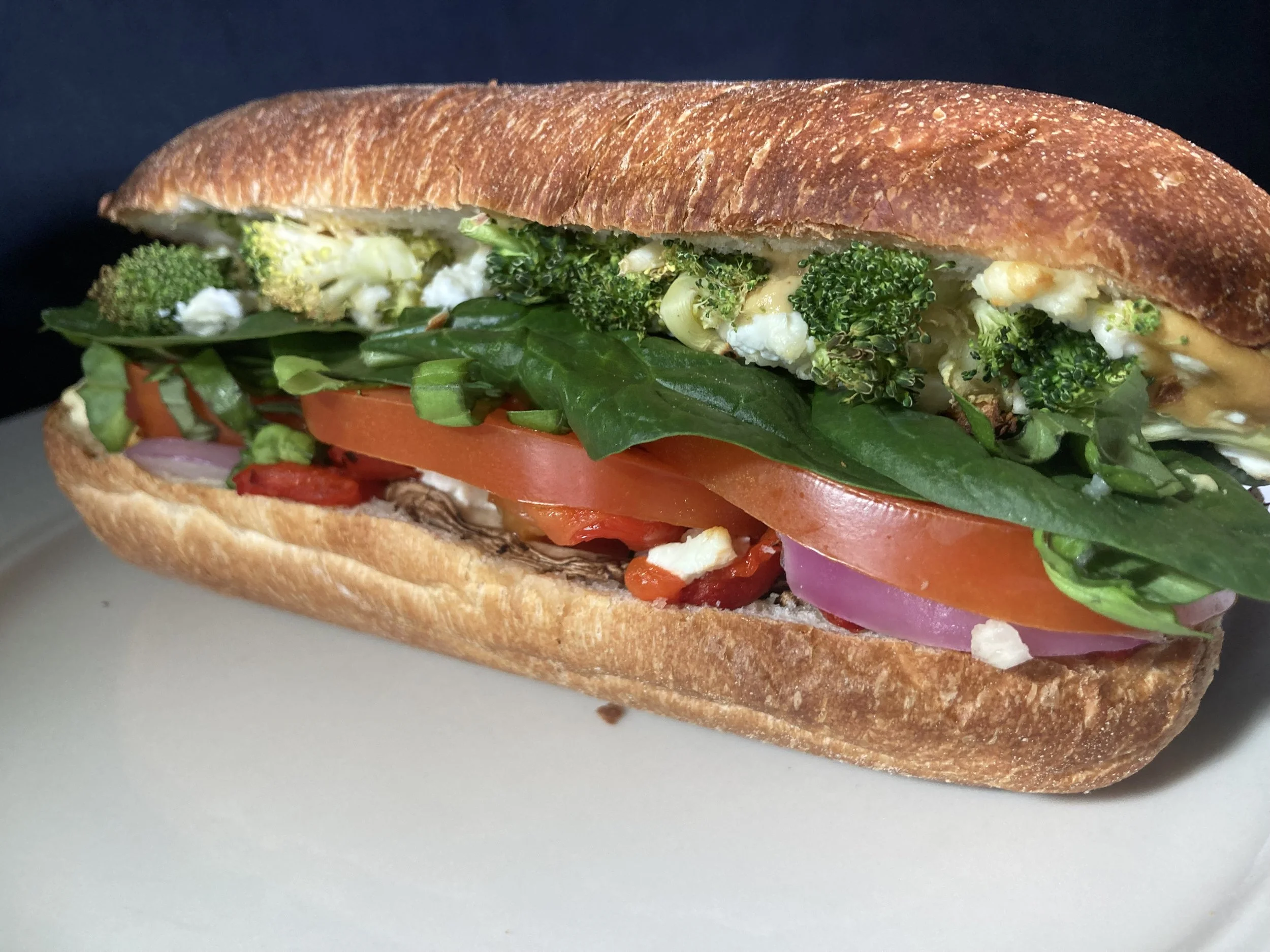 Heavy Veggie sandwich from Bryn Mawr Pizza & Deli with Dijon, red onion, broccoli, roasted red pepper, mushroom, goat cheese, fresh basil, spinach, and tomato