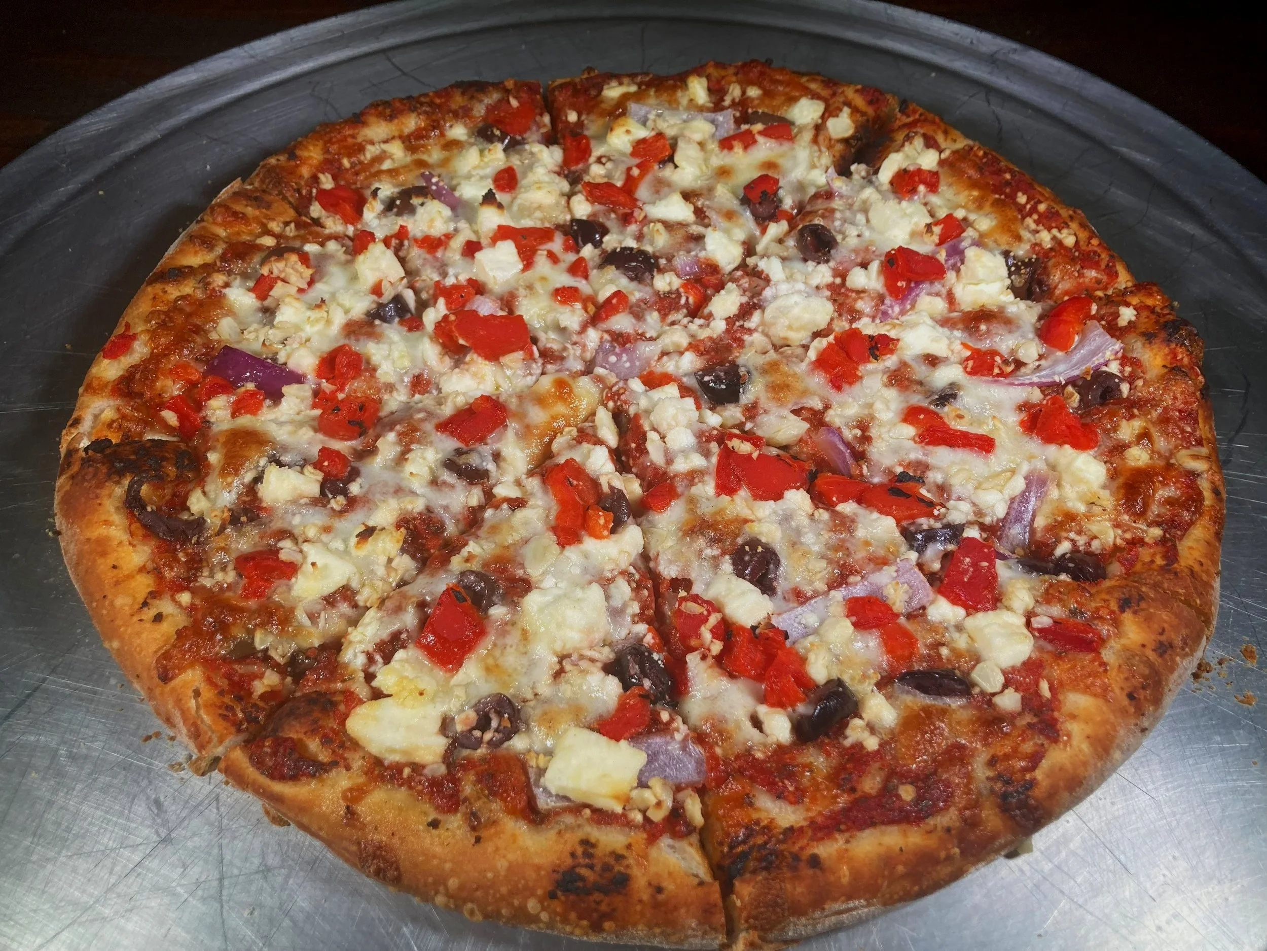 Margherita pizza from Bryn Mawr Pizza & Deli with olive oil–blended sauce, fresh mozzarella, shredded mozzarella, tomatoes, and fresh basil