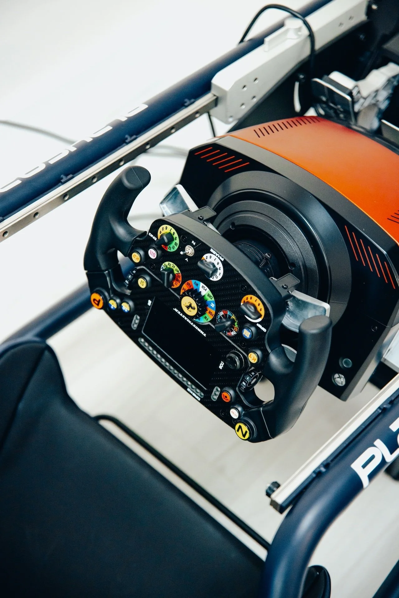 Racing simulator setup with steering wheel and buttons