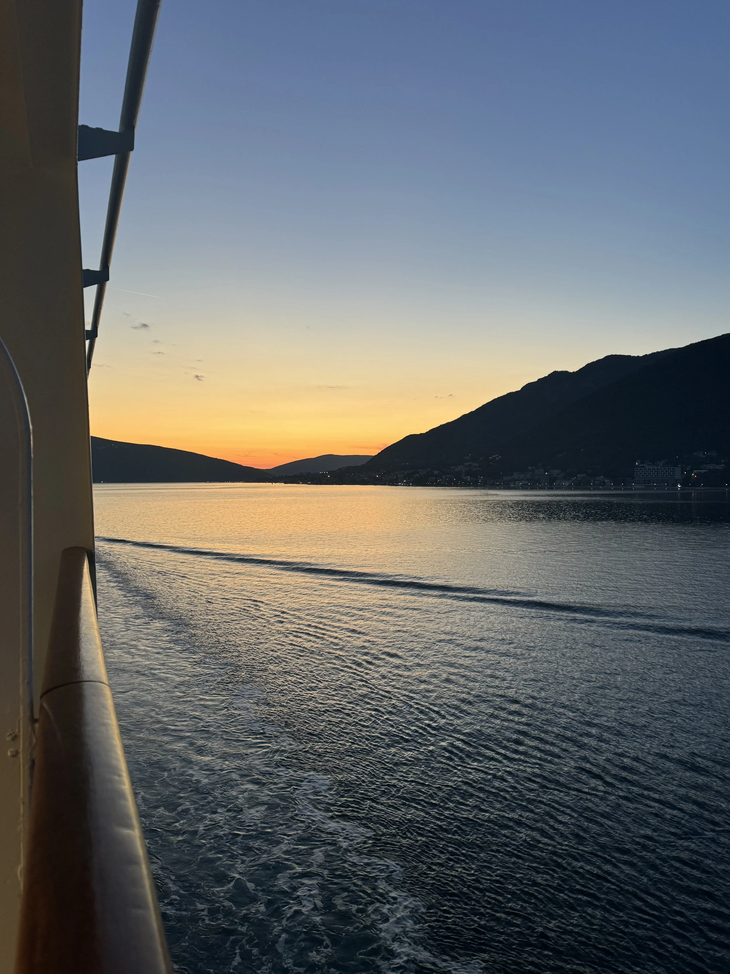 Balcony views of mediterranean sea at sunset on family cruise