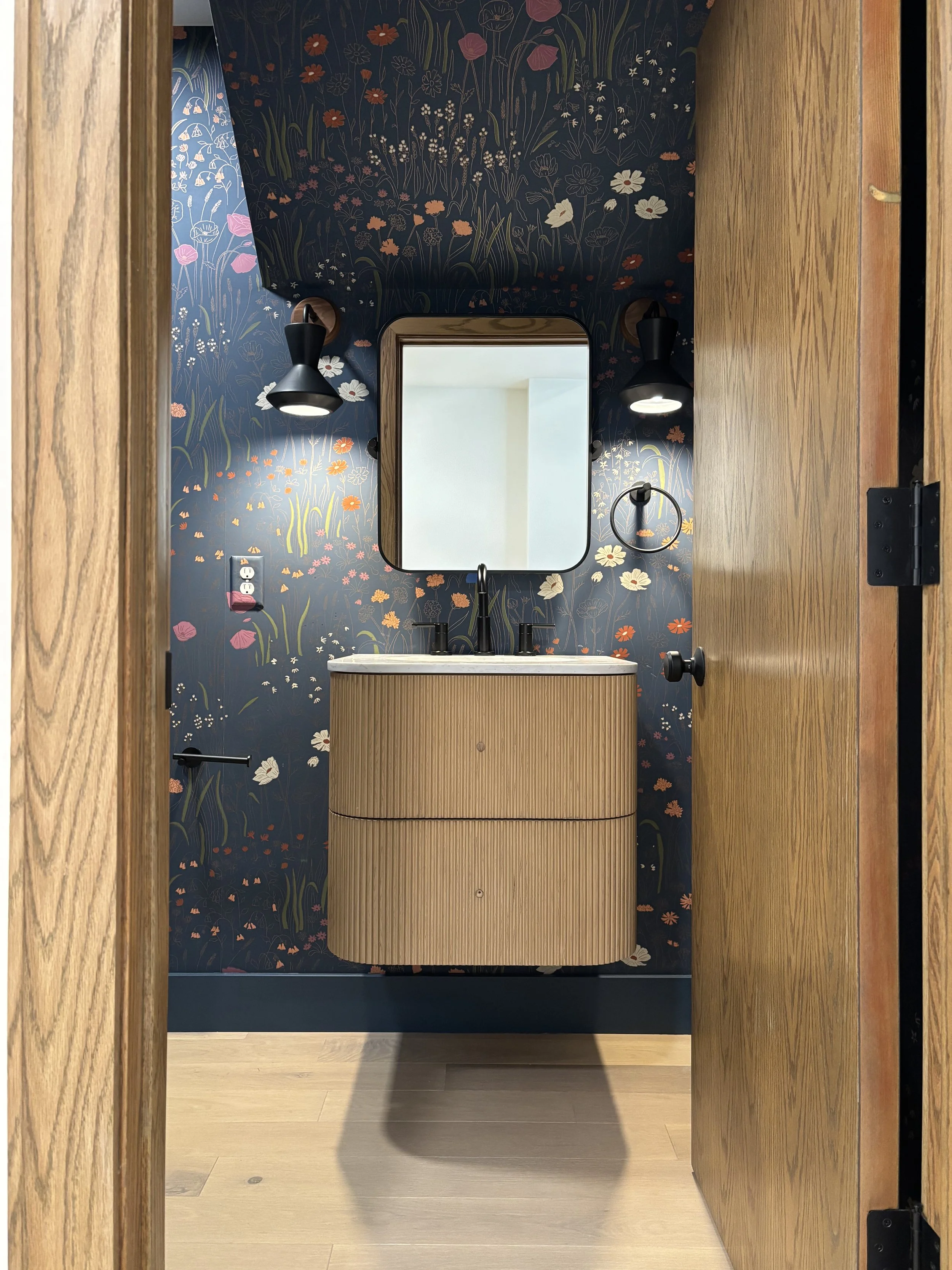 Whimsical wallpaper and Custom Bathrooms