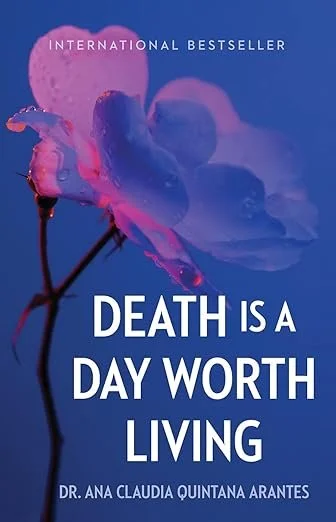 Book cover with a dark purple background, featuring a pink and purple flower with a dark stem, and the title 'Death is a Day Worth Living' by Dr. Ana Claudia Quintana Arantes