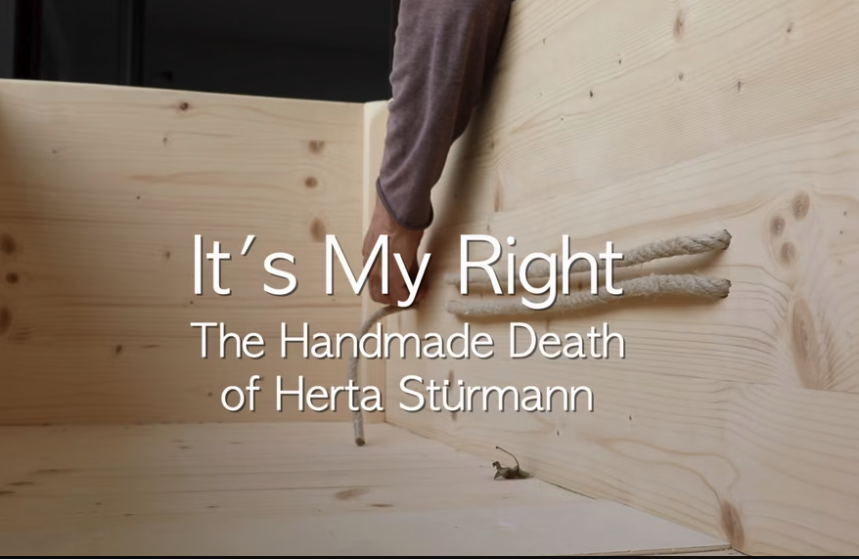 Close-up of a person working on a wooden structure, with text overlay reading 'It’s My Right: The Handmade Death of Herta Stürmann.'