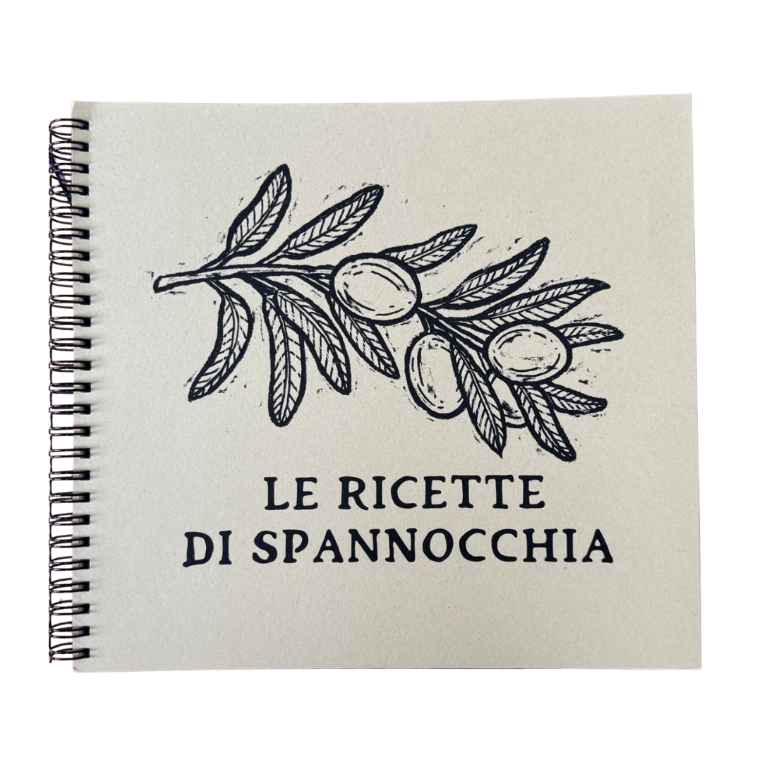 Cover of a recipe book titled 'Le Ricette di Spannocchia' with a black and white illustration of an olive branch with olives.