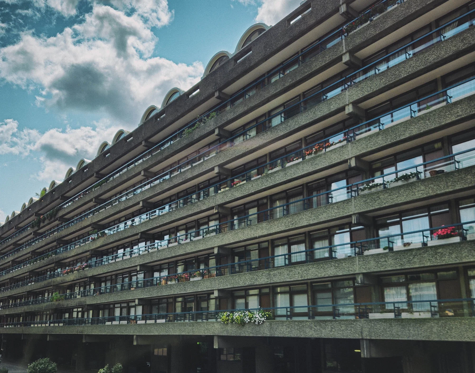 Wide view of the Barbican Estate in the City of London showing its raised walkways, terraces and concrete towers