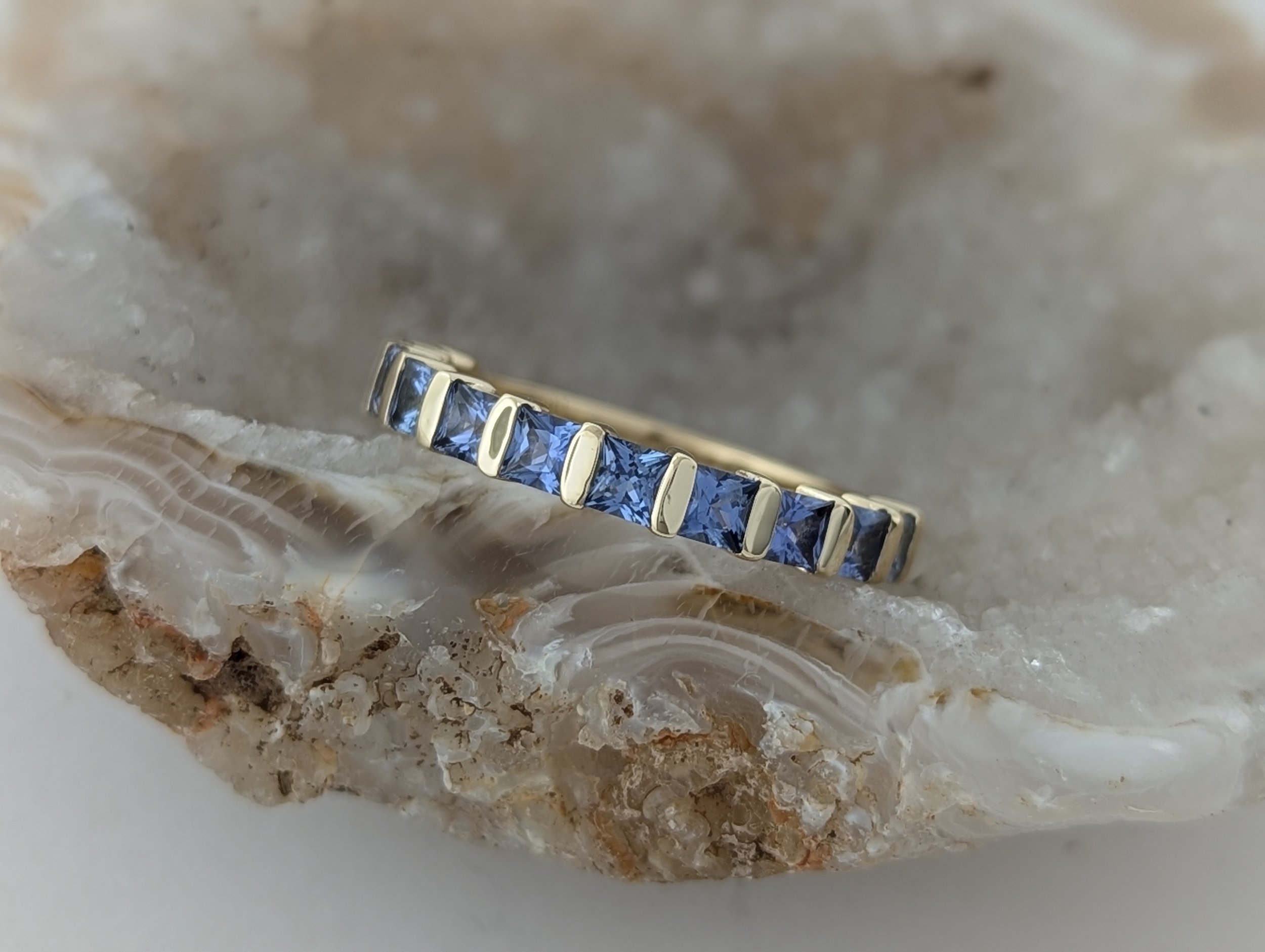 Montana Yogo Sapphire channel set band in 14k yellow gold, 1.3tcw.