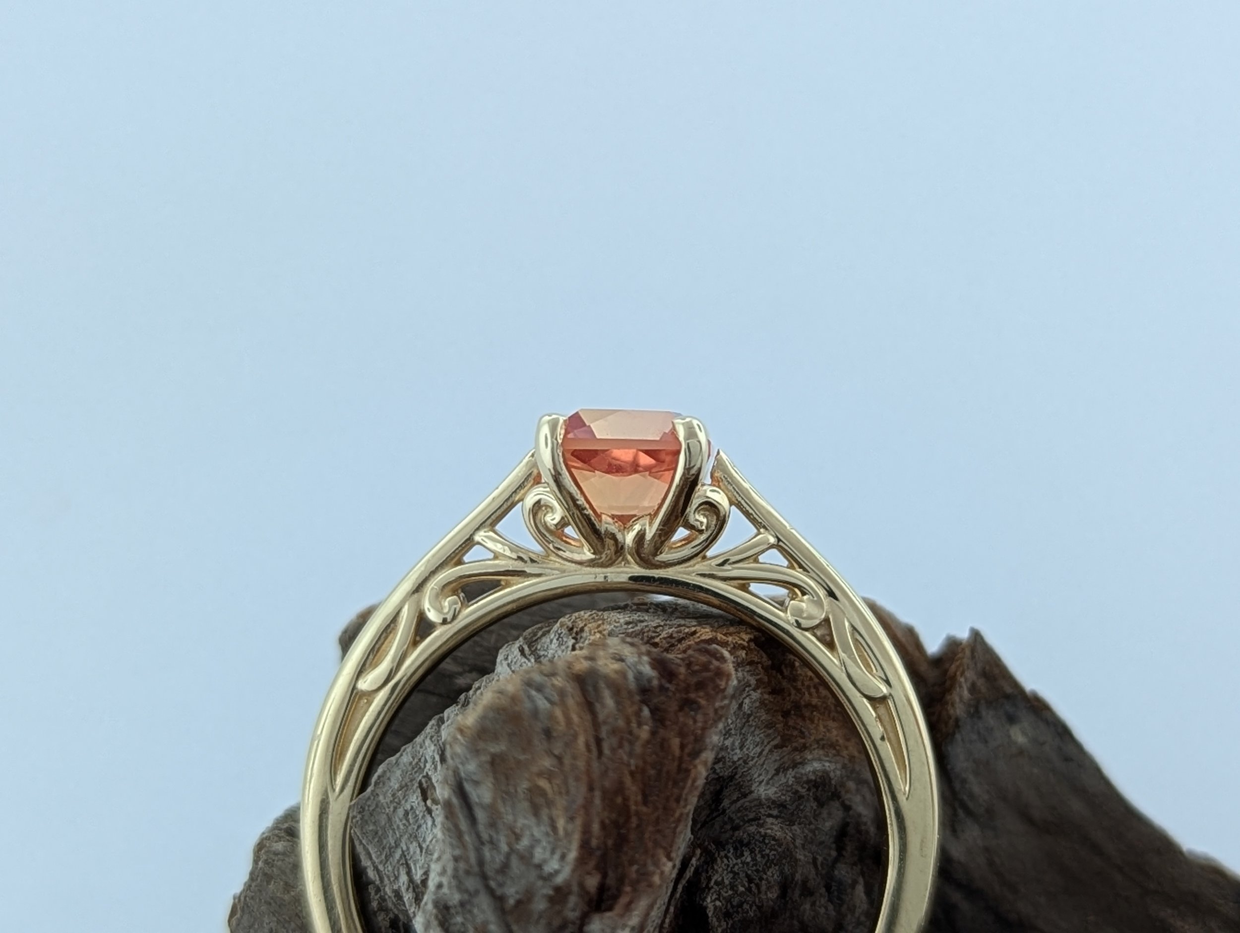 1.65ct Asscher cut orange Montana Sapphire ring with filigree detailing in 14k yellow gold.