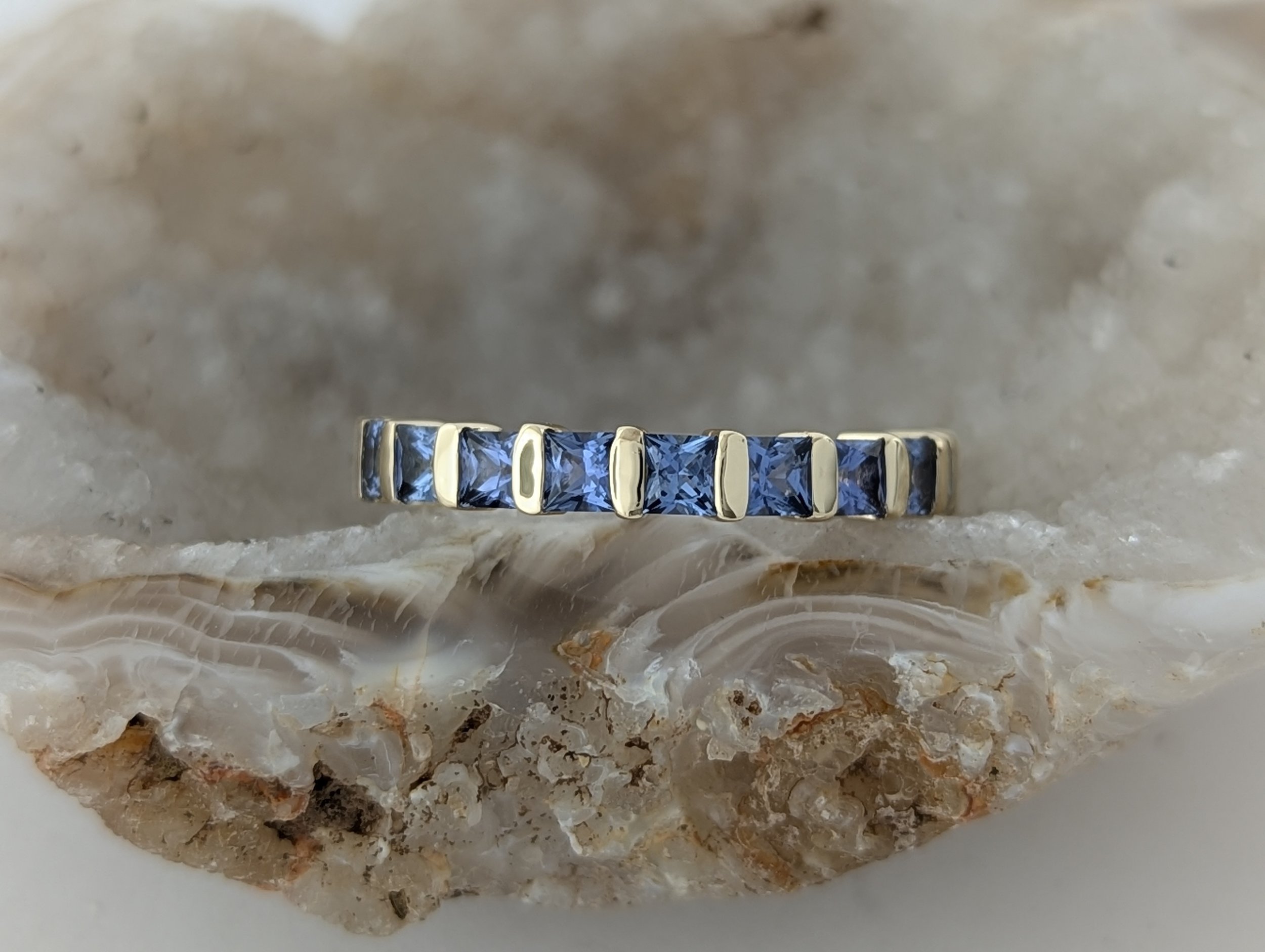 Montana Yogo Sapphire channel set band in 14k yellow gold, 1.3tcw.