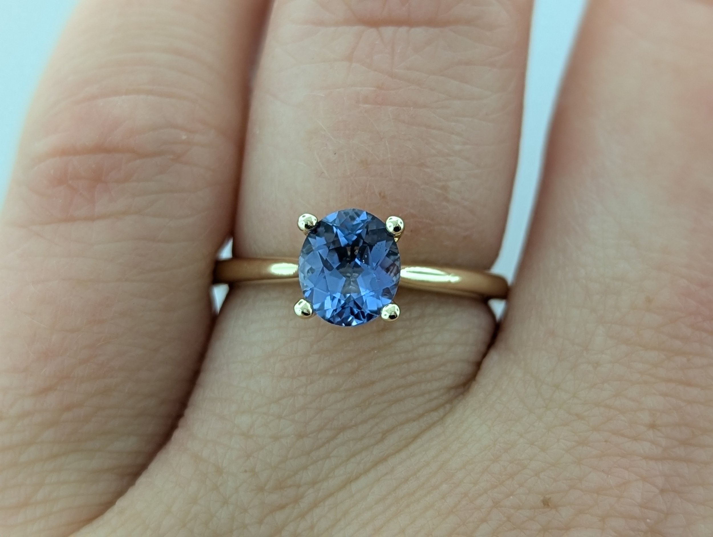 1.25ct oval Montana Yogo Sapphire engagement ring in 14k yellow gold.
