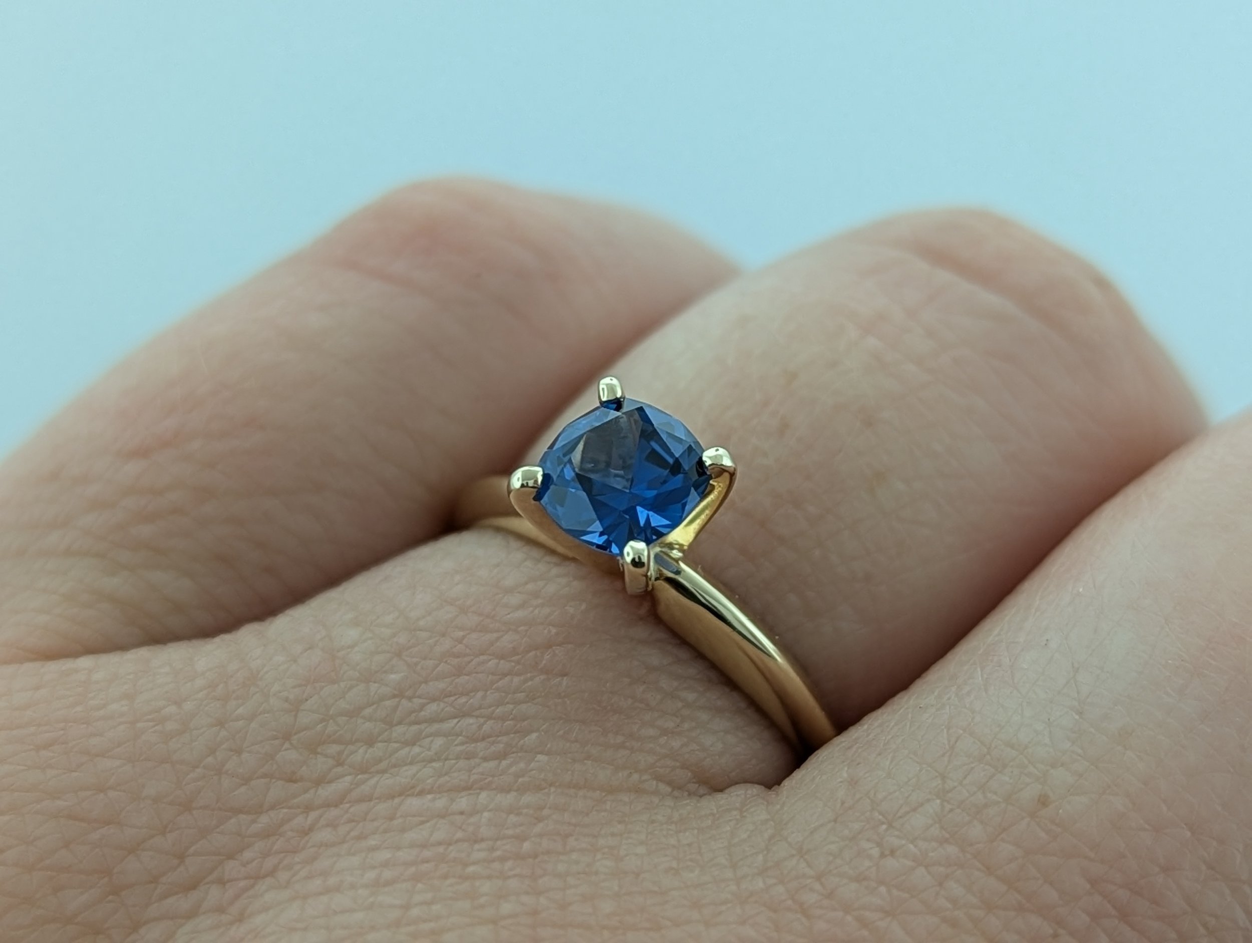 0.86ct cushion-cut AAA Montana Yogo Sapphire ring in 14k yellow gold with a vibrant cornflower blue gemstone.
