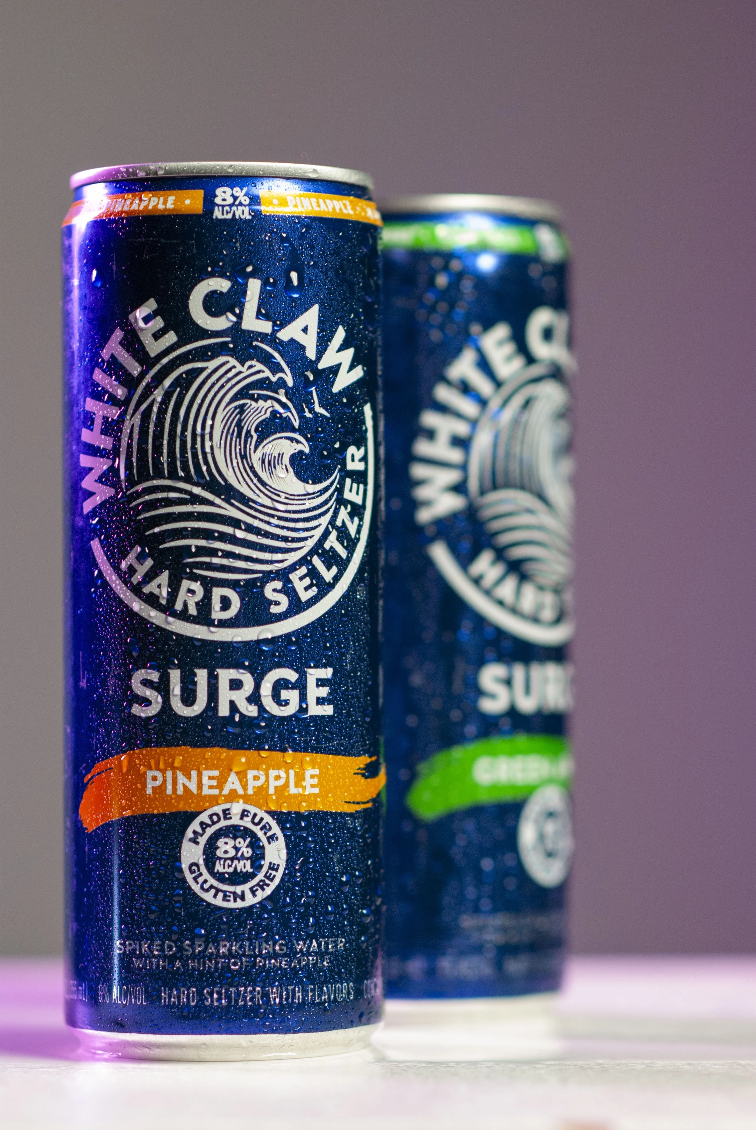 Two cans of white claw surge drinks