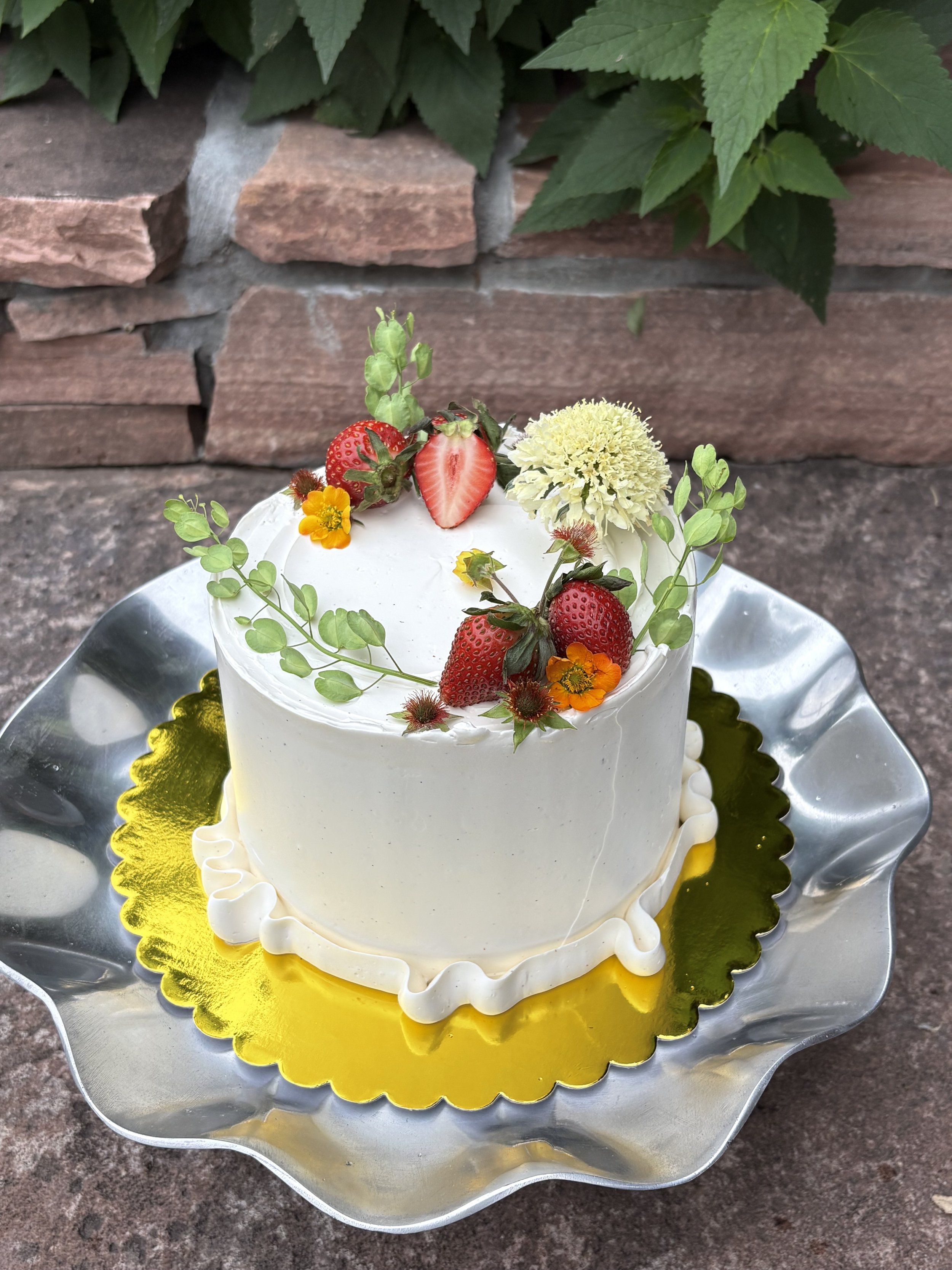 cocoa rye chiffon / macerated strawberries / vanilla mascarpone whip / vanilla bean swiss meringue buttercream
