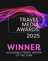 Travel Media Awards 2025 winner badge for Accessible Travel Writer of the Year with pink and purple abstract design.
