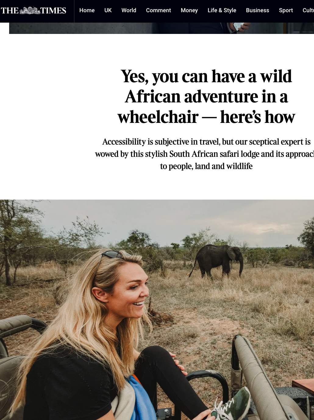 A smiling woman with long blond hair, wearing a black shirt, sitting in a safari vehicle with two other seats visible. She is in a savannah landscape with sparse trees and an elephant in the background. The scene is part of an article about a South African safari lodge and wild African adventures.