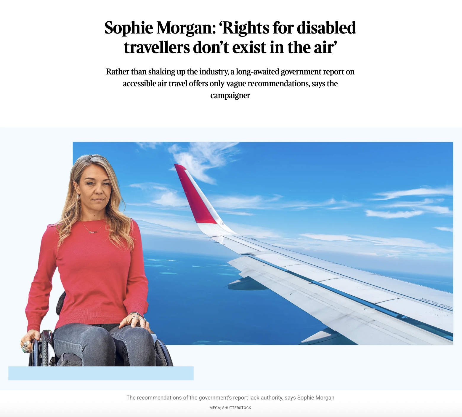 A woman in a red shirt sitting in a wheelchair in front of an airplane wing during flight, with blue sky and white clouds in the background.