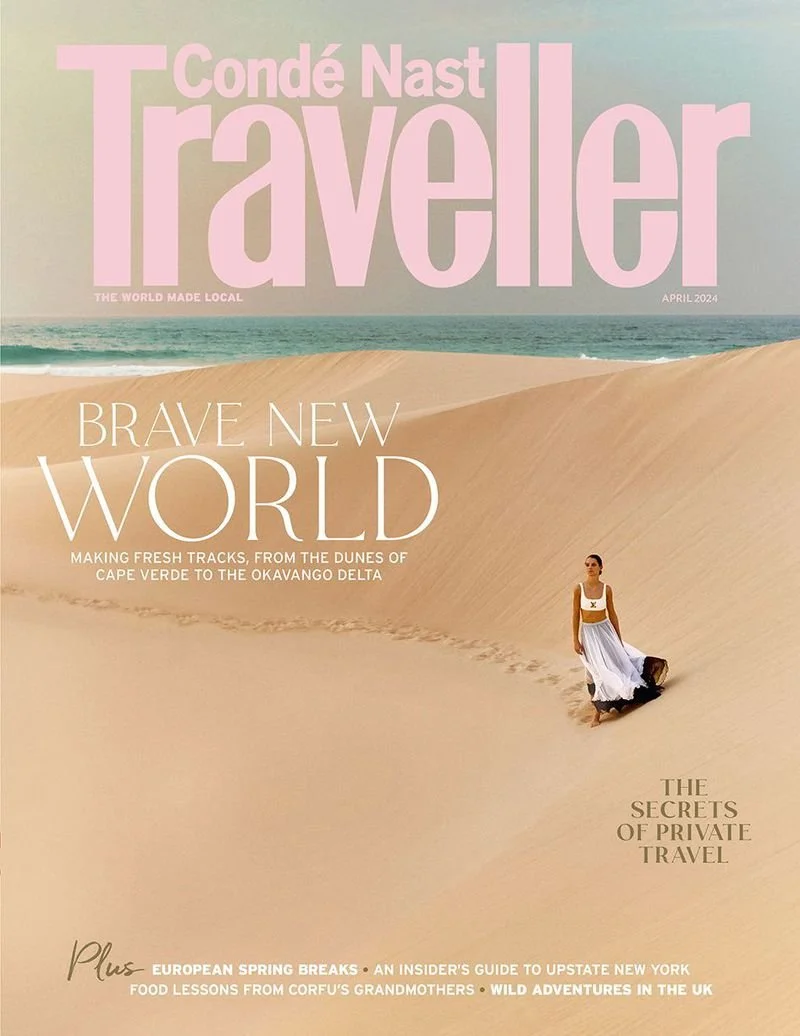 A dark sky with a bright, streaking contrail from an aircraft, illuminated at the edges, crossing diagonally from the bottom left to the top right of the image.