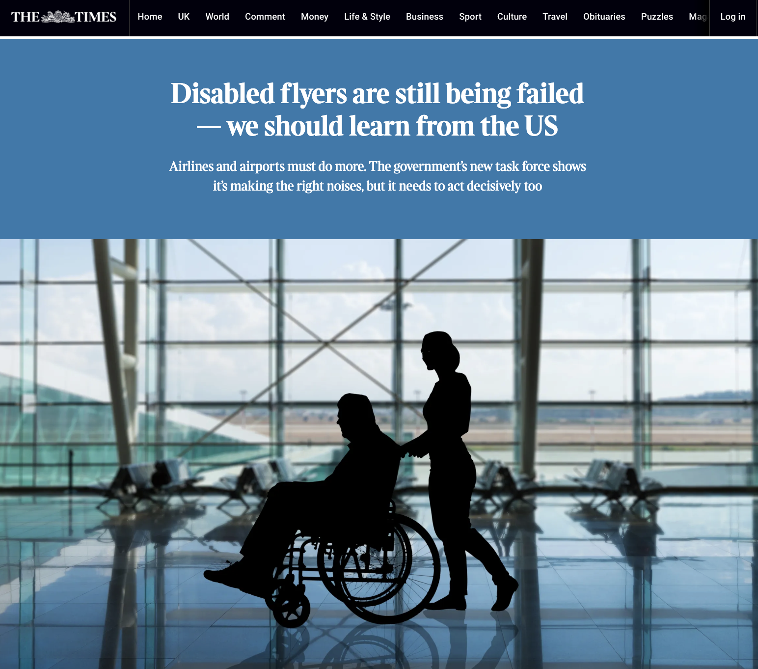 Silhouette of a person in a wheelchair being pushed by another person inside an airport terminal with large glass windows and a view of the tarmac outside.