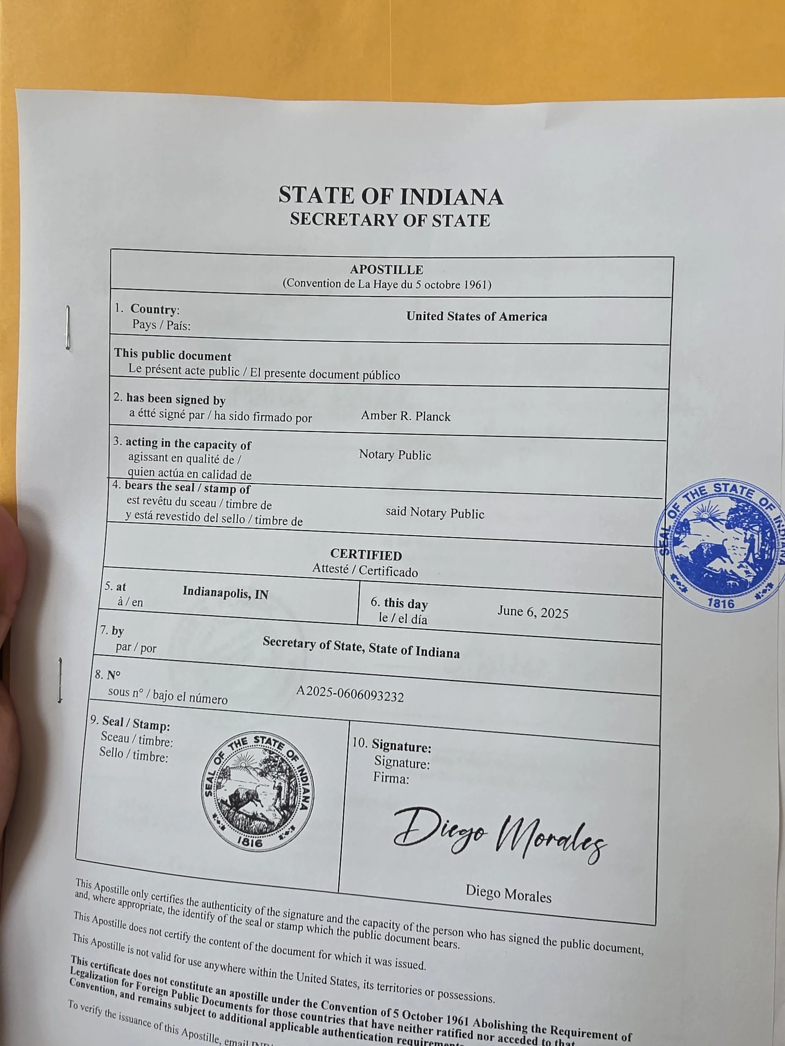 Completed Indiana apostille certificate attached to an official document ready for international use.