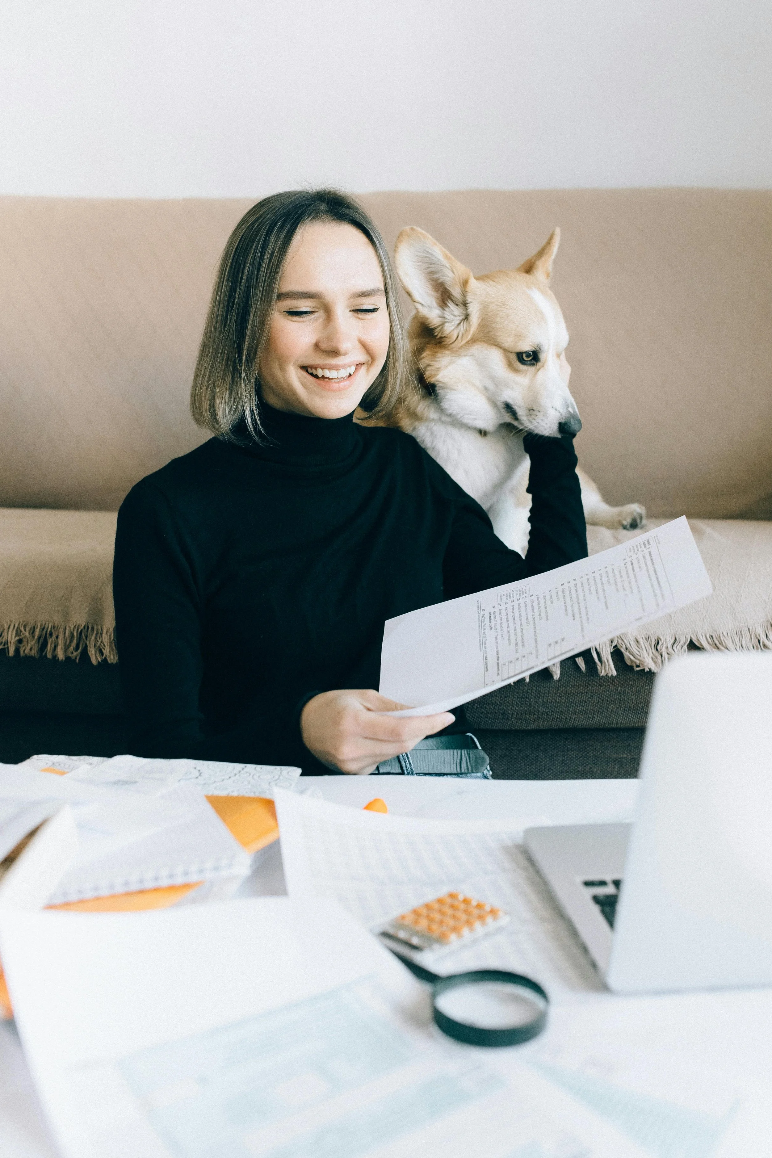 Woman smiling while preparing an Indiana birth certificate for apostille processing in Indianapolis.