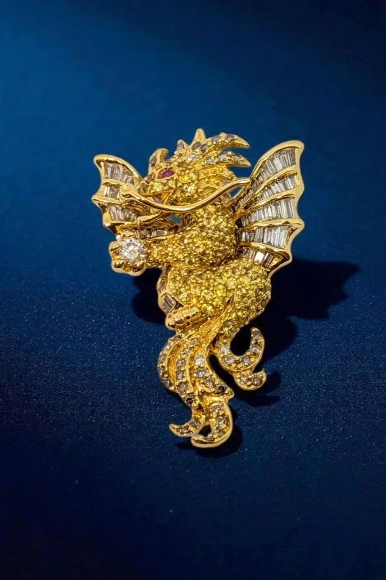 Dragon brooch in 18K yellow gold, set with white, yellow, & brown diamonds, and rubies 