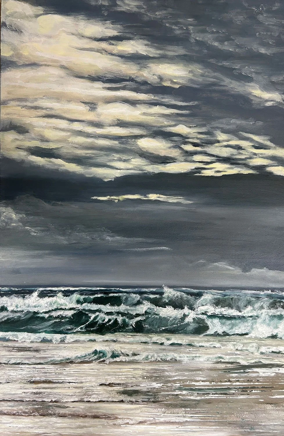Expressionist seascape at daybreak in winter after a storm celebrating sunlight through the clouds