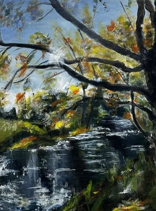 A painting of Beilsdown River, Dorrigo surrounded by autumn trees with green, yellow, and orange leaves.
