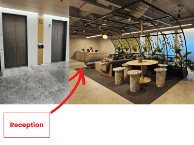 Modern office reception area with seating and greenery.