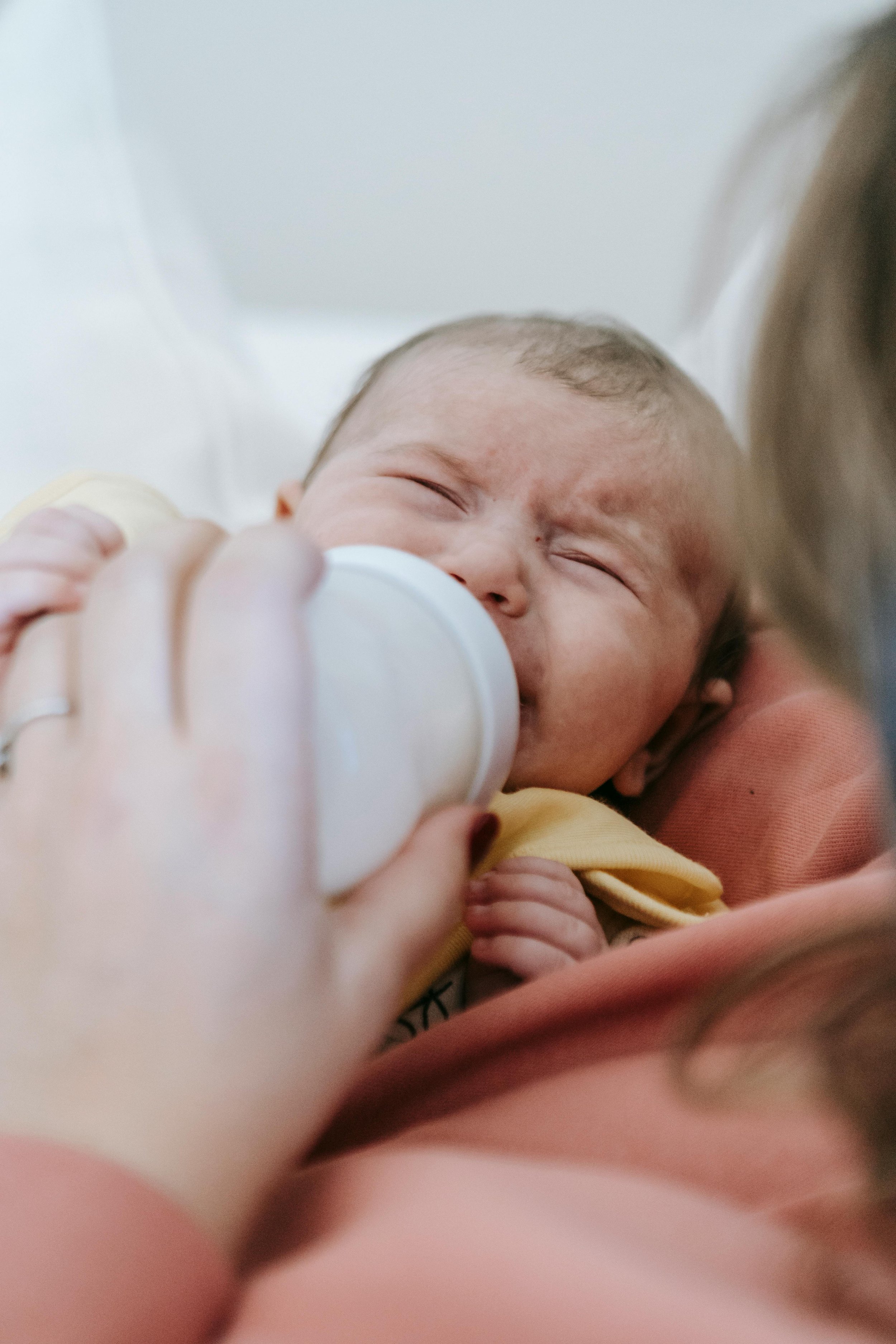 A baby being bottle-fed.