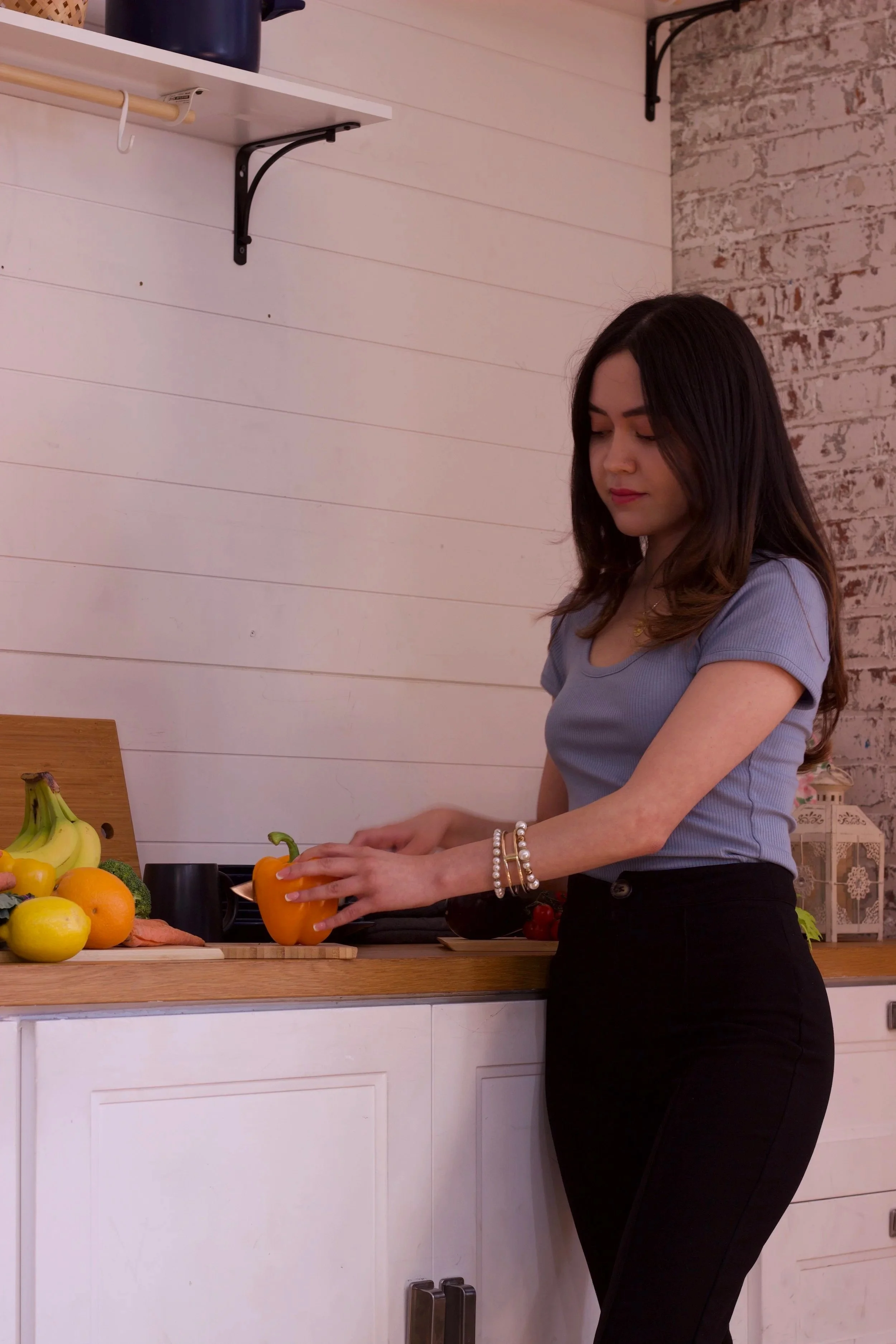 Allondra Gonzalez RD nutritionist preparing healthy meal for women's health and anti-inflammatory diet