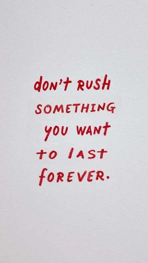 A white wall with red handwritten-style text that reads, "don't RUSH SOMETHING you WANT to LAST forever."