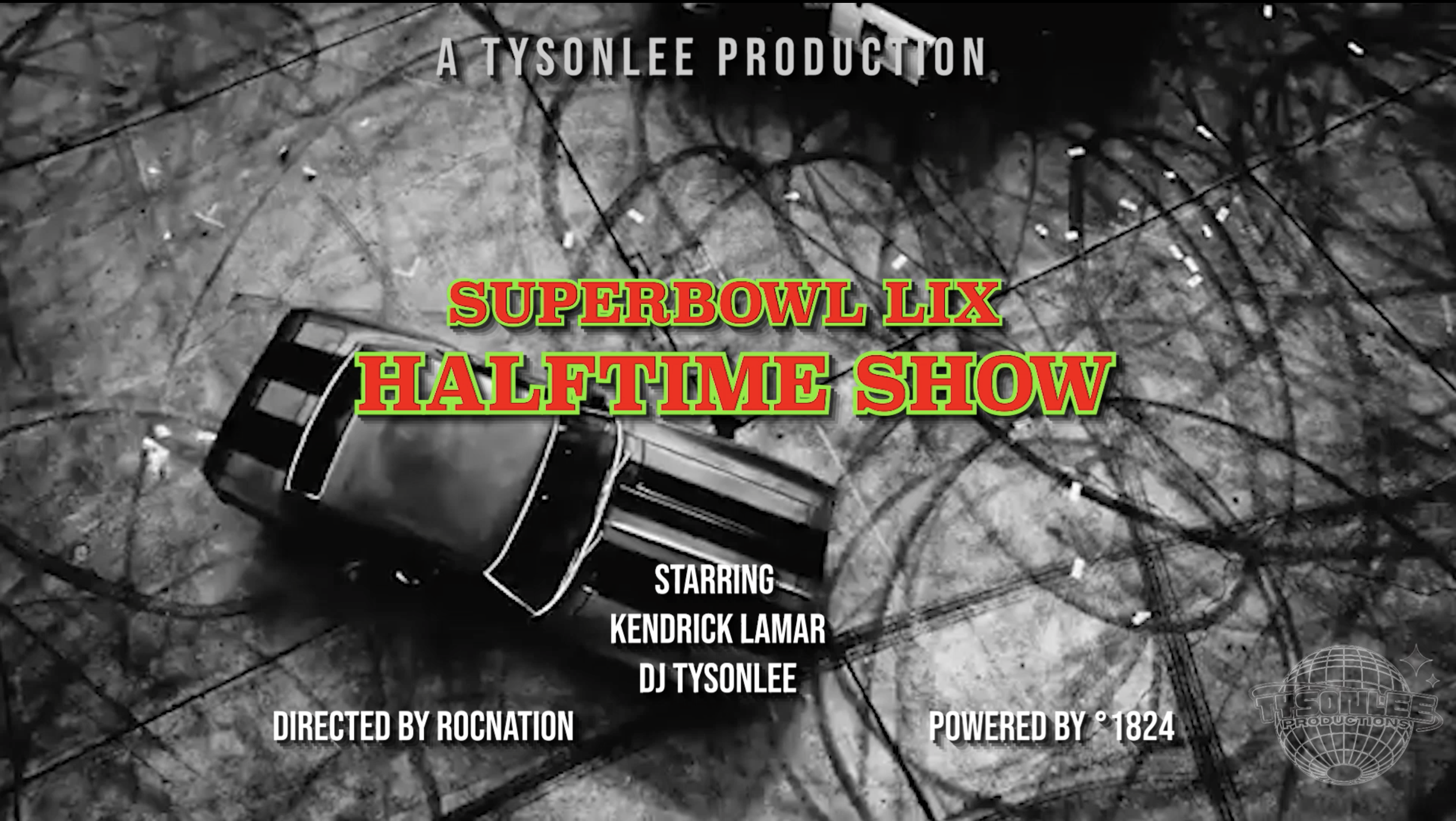 Black and white image of a car wreckage on a dark, bumpy road with overhead wires. The text overlay reads: "A TYSONLEE PRODUCTION, SUPERBOWL LIX HALFTIME SHOW, STARRING KENDRICK LAMAR, DJ TYSONLEE, DIRECTED BY ROCNATION, POWERED BY 1824."
