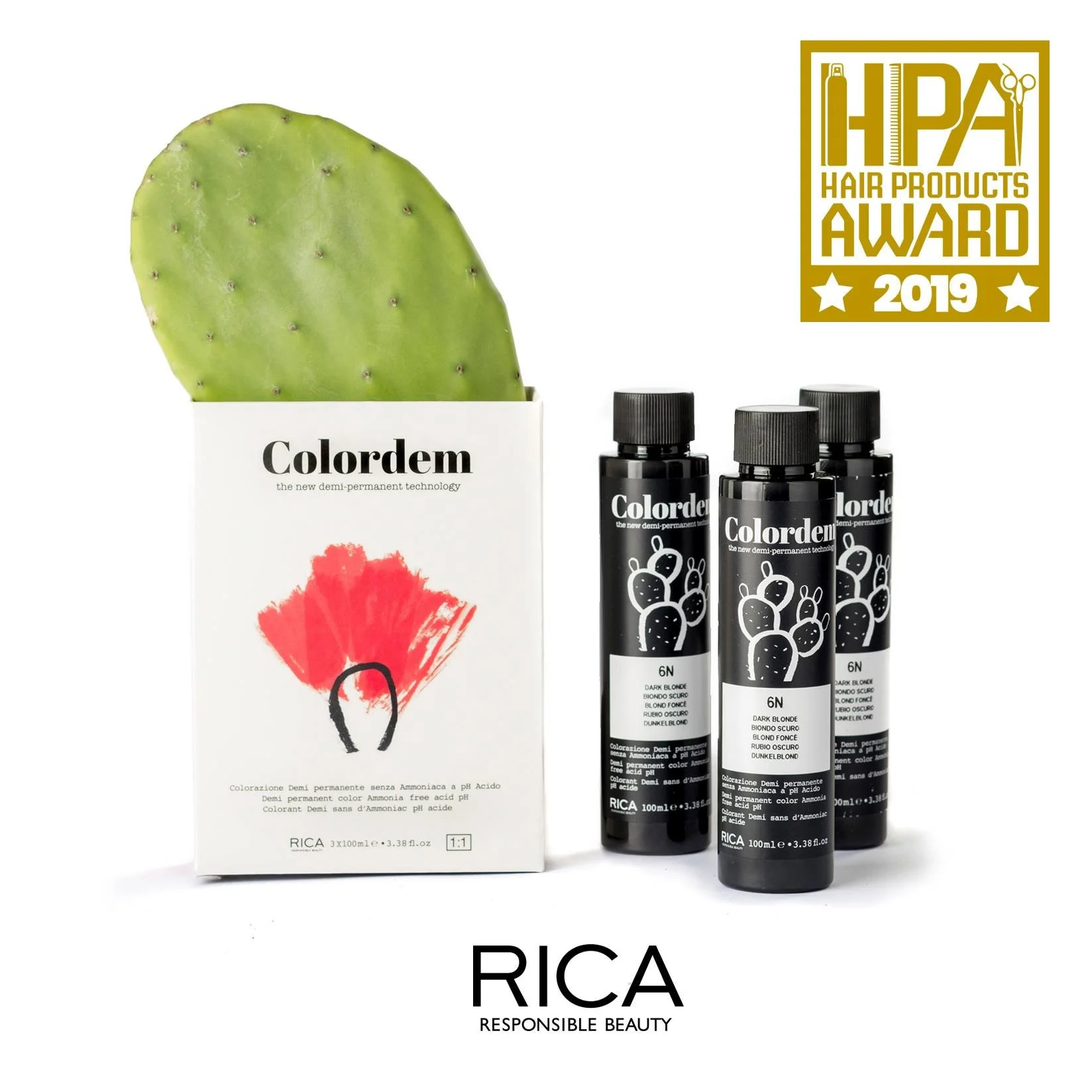 Produit capillaire Colordem, trois bouteilles noires de coloration semi-permanente, devant une boîte avec une feuille de cactus et un logo HPC 2019, avec l'inscription RICA RESPONSIBLE BEAUTY.