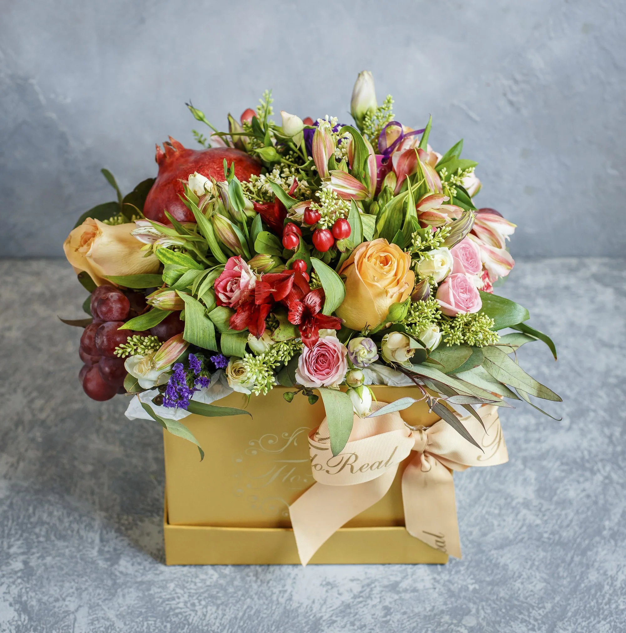 beautiful-flower-bouquet-with-pomegranate-grapes-yellow-box-with-bowtie.jpg