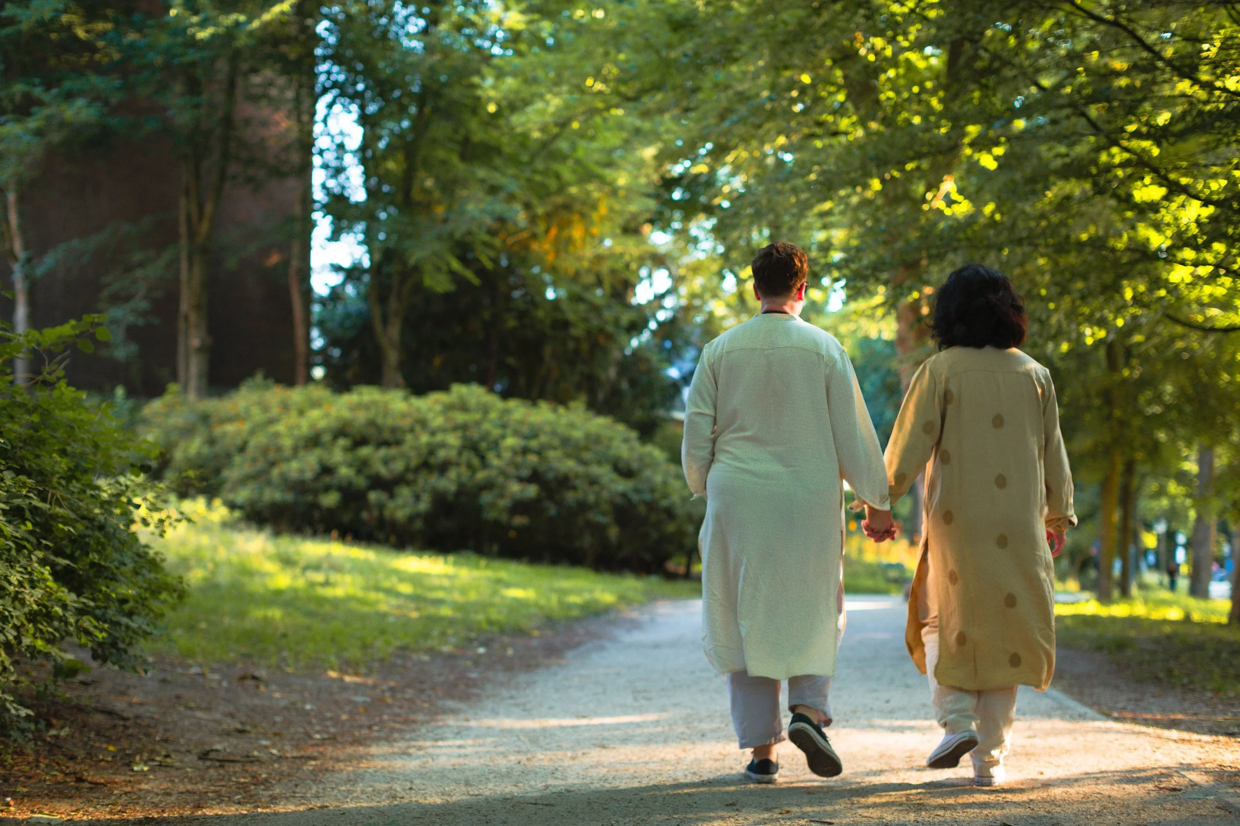 Walking side by side on a park path