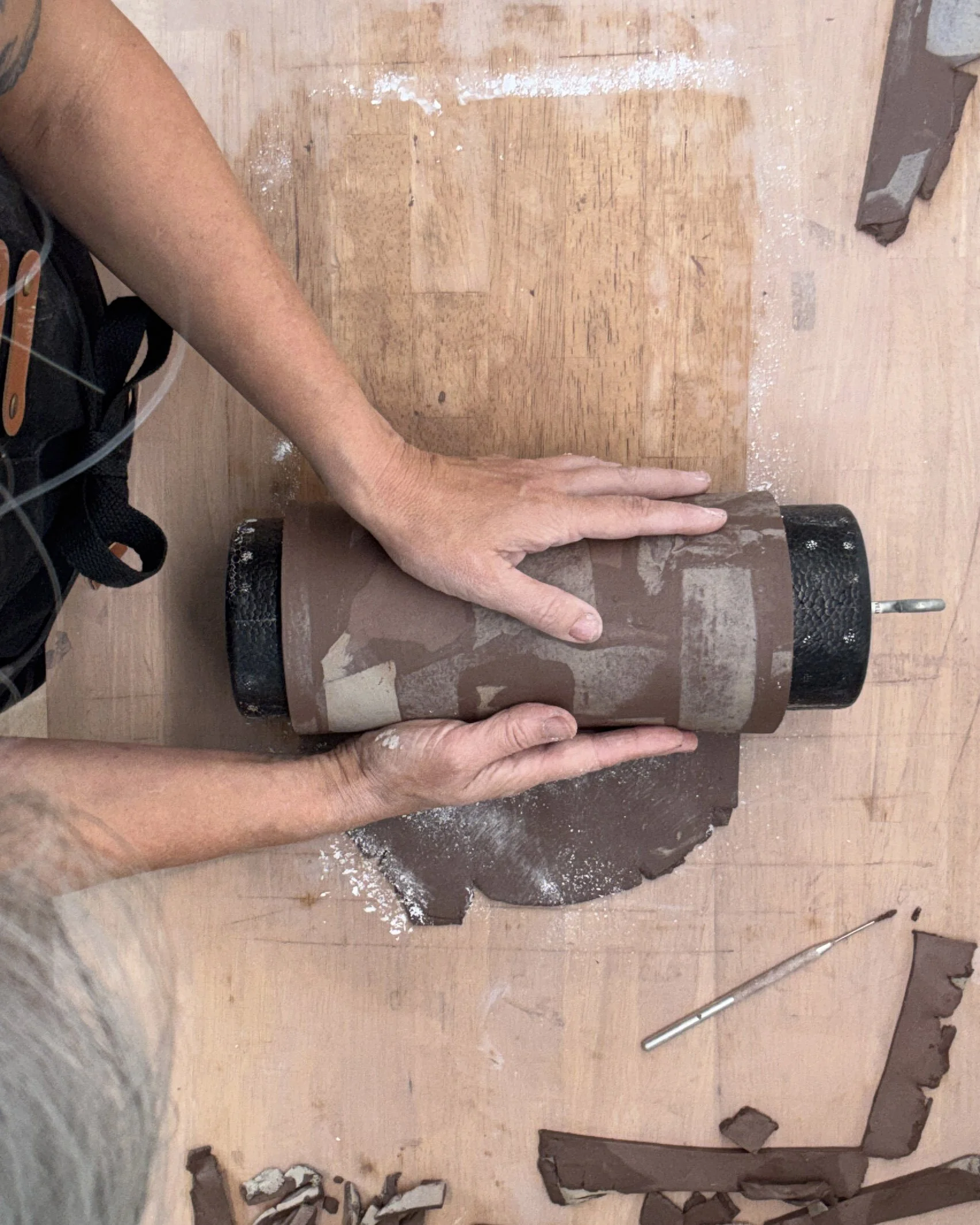 The slab is wrapped around a form to establish the vessel's shape.