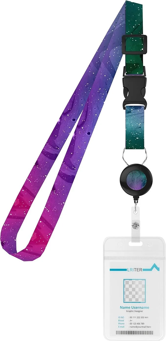 A lanyard with a galaxy pattern in purple, blue, and green, attached to a badge reel and a clear identification card holder.