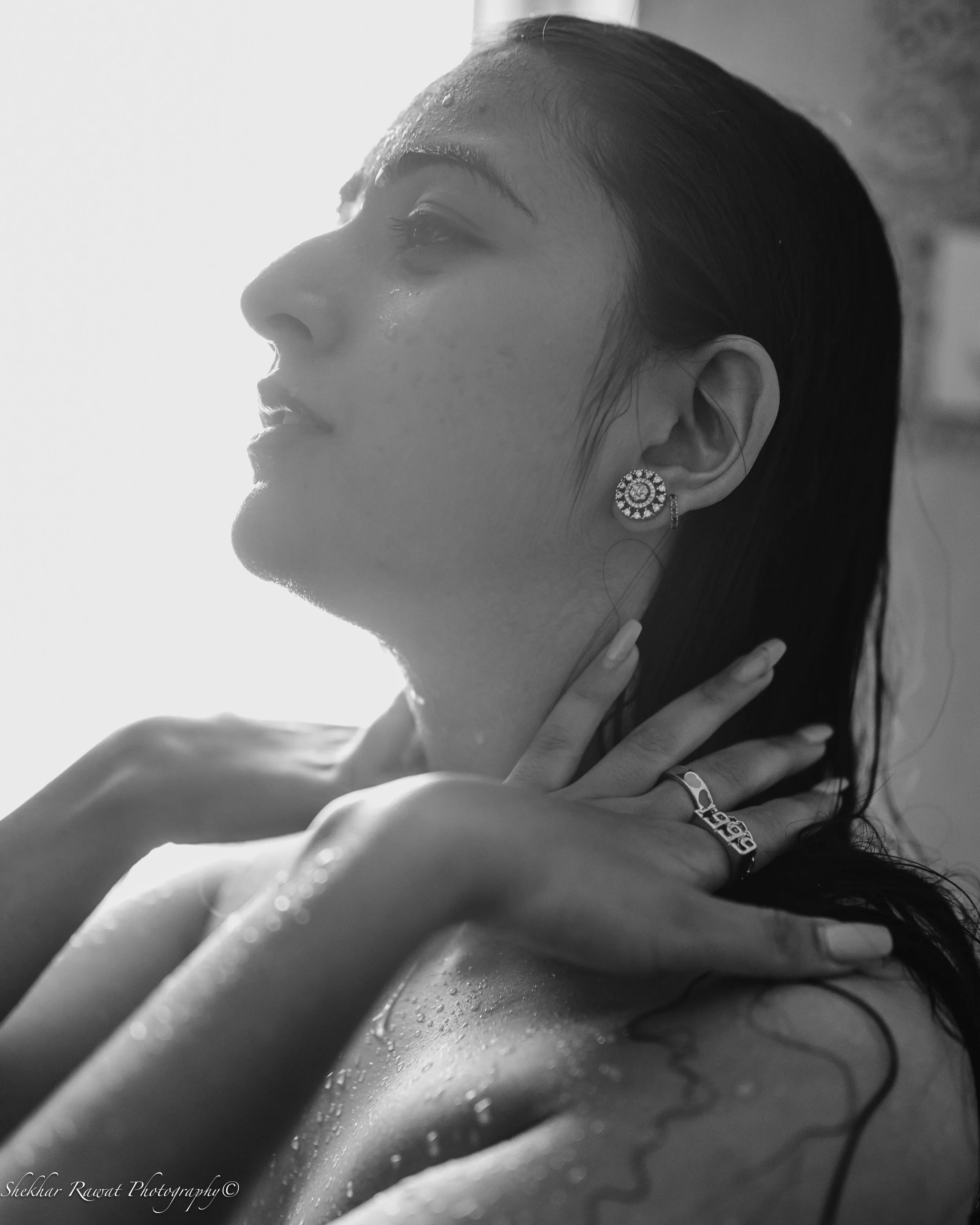 Black and white wet-hair portrait with water droplets, moody beauty portrait by Melbourne photographer Shekhar Rawat